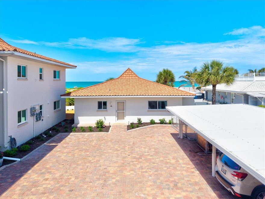 One or more photo(s) has been virtually staged. Villa Chateaugay – A Rare Gulf-Front Retreat
Experience a truly exceptional opportunity to own a one-of-a-kind Gulf-front villa that lives like a private single-family home while offering the effortless, maintenance-free lifestyle of condominium living. Perfectly positioned within a welcoming and socially vibrant beachfront community, this beautifully remodeled residence is a rare gem.
Villa 1 is the only standalone, single-story residence in the complex - offering the privacy and feel of a Gulf-front single-family home. With over 1,300 square feet of thoughtfully designed living space, this fully renovated villa features a private entrance, open-concept floorplan, and an abundance of natural light throughout. Hurricane-impact windows and doors, plantation shutters, and serene peek-a-boo Gulf views framed by coastal dune foliage create an inviting and tranquil atmosphere.
The heart of the home is a stunning, modern kitchen designed for both everyday living and entertaining. Outfitted with 42-inch solid wood cabinetry, full-extension dovetail drawers, soft-close hardware, quartz countertops, stainless steel appliances, and a tasteful contrasting island, it seamlessly flows into the living space. A blue glass tile backsplash and closet pantry add both style and functionality.
The spacious primary suite offers a peaceful retreat with direct access to the air-conditioned sunroom and a private screened porch - perfect for enjoying coastal breezes. The en-suite bath is discreetly tucked away, providing comfort and convenience, while a generously sized walk-in closet houses a full-size stacked washer and dryer, an uncommon luxury in condominium living.
Nearly every inch of this villa has been meticulously updated, including water and sewer lines, HVAC system, impact glass windows and doors, new appliances, flooring, trim, solid-core doors, hardware, and all plumbing and lighting fixtures. Additional enhancements such as fresh neutral paint, motorized sunshades in the sunroom, plantation shutters, and an exterior storage room complete the home.
Chateaugay is a well-managed and beautifully maintained community known for its friendly atmosphere and engaging lifestyle. Residents enjoy sunset gatherings, relaxing around the heated community pool, and other community activities. This well-maintained community enjoys newer roofs and carports, freshly painted buildings, upgraded landscaping, and attractive paver parking lots. Perfect location - just a short walk to the Venice Yacht Club, Freedom Boat Club, and Crow’s Nest.
Villa Chateaugay offers the rare combination of Gulf-front, single-family-style living at a fraction of the price, blended seamlessly with the ease and peace of mind of condominium ownership. Isn’t it time to experience life at the beach in a place this special?