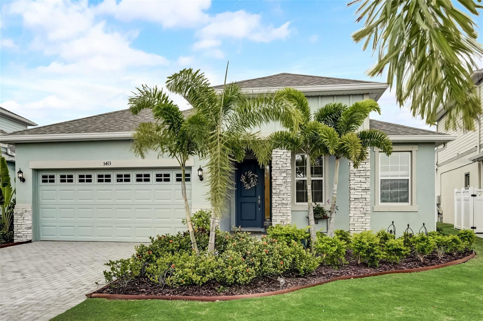 Welcome to 5413 Wishing Arch Drive, a beautifully designed 3-bedroom, 2-bath Margate floor plan by Park Square Homes, featuring a formal office and 1,966 square feet of thoughtfully planned living space. Built in 2021 and located in the waterfront community of Mirabay, this home sits on a dockable lot with expansive lagoon views and no front or rear neighbors. The dock easement has already been paid for, and the seller has invested in full dock plans—along with professionally designed pool plans—both included in the MLS attachments. Inside, you’ll find upgraded tilework, crown molding, and a custom built-in bar that anchors the open living area—ideal for entertaining. The dedicated office is enclosed with upgraded glass doors, offering a quiet and stylish space to work or relax. The spacious backyard provides ample room to add a pool, making it easy to personalize your own outdoor retreat. This home is just a short walk to the award-winning Mirabay clubhouse and sits directly across the canal, giving you a front-row seat from your backyard to enjoy the community’s live music events and vibrant waterfront lifestyle. From your private dock, it’s just minutes to waterfront dining, dolphin and manatee sightings, and world-famous fishing. Community amenities include two year-round heated pools, a café and lounge, 24-hour fitness center, walking trails, and courts for pickleball, tennis, and basketball. With smart upgrades, paid-for enhancements, and a prime waterfront location, this home offers a rare opportunity to enjoy the best of Florida living in one of Apollo Beach’s most sought-after neighborhoods.