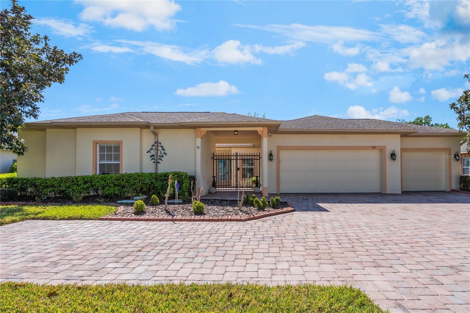BRAND NEW PHOTOS FOR BRAND NEW UPGRADES! These new water-resistant Laminate floors have transformed this home to truly show like a model! This home is located on one of the most private and spacious lots in the premier gated 55+ community, Solivita, a Community which was designed for active, inspired living. This stunning BOLERO model sits on nearly 1/3 acre with panoramic conservation views and offers the perfect blend of privacy, space, and style. Featuring 3 bedrooms (including a private Casita), 3 full bathrooms, and an oversized 3-car garage with over (20) feet of built-in storage. This home was designed with comfort and entertaining in mind. An extremely large brick-paver driveway accommodates 8+ cars, perfect for welcoming guests including a private parking spot right next to the Casita. The entry gates lead into the large paver courtyard which permits access both the Main House and Casita. The Main House has a bright, open floor plan with new LVP flooring throughout and two 9' - 3-panel sliding glass doors that frame the lanai and serene conservation views. The spacious kitchen, one of the largest layouts in Solivita, boasts brand-new stainless-steel appliances (2025), generous counter space, and a seamless connection to the dining, living and den areas. The Casita features a large, bright open space, with a walk-in closet, linen closet and large full bathroom. There is easy private access to the Casita from the French-door located in the front courtyard. The oversized brick-paver lanai with custom vinyl windows can be easily opened to enjoy Florida's breezes or closed for year-round comfort. Surrounded by mature landscaping and nature, your backyard is a private oasis. The Owner's Suite offers a sitting area, two walk-in closets with custom California type shelving, and a spa-like bath with dual vanities, a soaking tub, and a separate shower. The Casita serves as one of the three bedrooms, complete with its own entrance and full bath, large walk-in in closet, linen closet all ideal for guests, hobbies, or a home office. Additional highlights: Luxury 3-car garage with custom shelving, workspace, and water treatment/reverse osmosis system. Secondary bedroom with private bath. Laundry room conveniently located near the garage entry. Enjoy Solivita's unmatched lifestyle amenities: 14 heated pools plus indoor pool and walking track, Fitness centers, pickleball, tennis, and golf. 250+ clubs, on-site dining, and social eventsLocated just 30 minutes from Disney and Orlando's top attractions, and minutes from the new Poinciana Lakes Plaza with shopping, dining, and multiple services. Experience the perfect mix of privacy, space, and resort-style living. Schedule your private showing today!