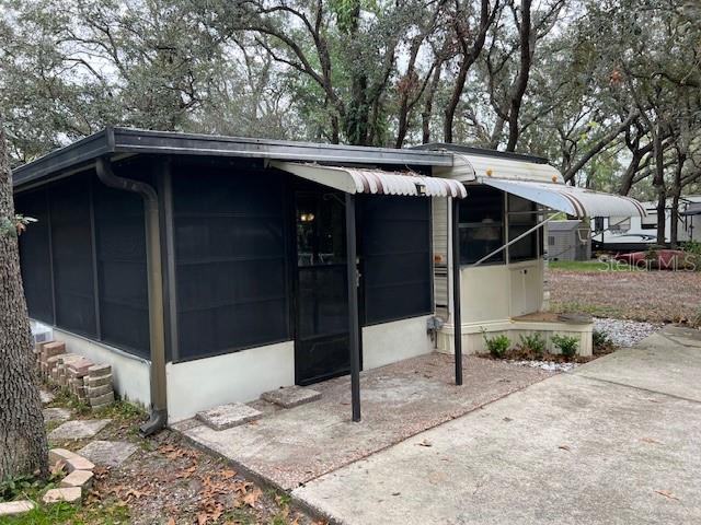 This cozy 364 sq ft trailer, complemented by a spacious 360 sq ft Florida room, offers comfortable living nestled on a 4,089 sq ft lot surrounded by tranquil trees at the back of the park. Located in the sought-after Clarcona Resort, this property provides access to a variety of community amenities, including a pool, playground, mini-golf, clubhouse, and secure gated entry.
Perfectly positioned with easy access to shopping, dining, hospitals, and major roadways, you’ll enjoy convenient proximity to Orlando. The best part? No lot rent – you own the land! Don’t miss out on this affordable and charming property in a prime location!
