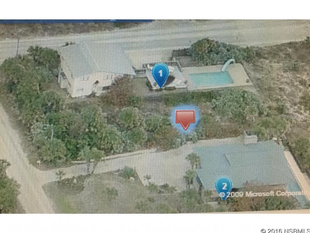 Direct Oceanfront Lot located in a desirable North Beach Location with good elevation, lots of protective rolling dunes, soft white sand & gentle ocean breezes. Build your dream home here and enjoy amazing sunrises rising over the Atlantic Ocean. Life doesn't get any better than this! Walk to Flagler Ave, shops and restaurants. Close to Beach Walkover.; Cleared: Partial