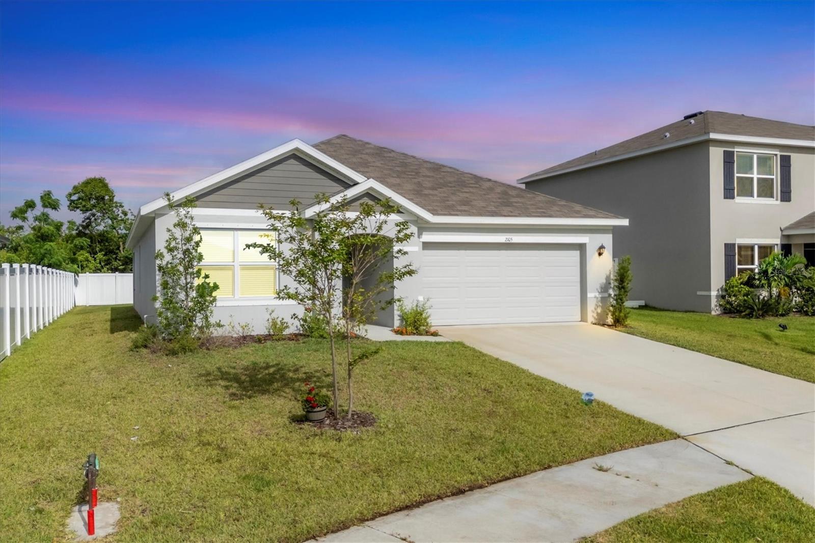 ~ Come experience living in The Villages of Glen Creek ~ This home featuring the ARIA floor plan model is practically brand new having been built just one year ago in 2024. This SMART enabled home affords you the luxury of controlling lights, adjusting the thermostat temperature and opening garage doors and your front door all from the convenience of your phone. Arrive at the gated entrance to an age and pet friendly development surrounded by a beautifully maintained, manicured and fenced community perimeter. Step inside and you'll find a split bedroom floor plan offering privacy that has maximized space with an open layout tying the Dining Room, Kitchen and Great Room together. The flooring features easy maintenance ceramic tile in the main living areas with soft carpeting in the bedrooms for comfort underfoot. This home checks all the boxes for even the most discerning of buyers with its newer construction and appliances. The Primary Suite, which is very well sized, overlooks the privately fenced in backyard and is complete with a walk-in closet and a large bathroom area that includes a tiled walk-in shower and linen closet. The kitchen, which is the true heart of this home, ties the main living areas together where you'll find granite countertops, stainless steel appliances, wood cabinets, a very large counter space that also accommodates barstool seating which will be just perfect when entertaining, a large closet pantry and a generous amount of cabinets for your storage needs. Living in an X non-flood zone represents savings for you on your homeowner's insurance costs along with peace of mind. The front yard is serviced by a sprinkler system sourced from the community pond. Hurricane shutters, which have never needed to be used, are included. A PVC privacy fence encloses the backyard offering a safe private sanctuary perfect for your weekend bbq's and romping playground for your little ones and pets in addition to a covered patio area to escape from on those warmer summer days. The reasonable $275/quarterly fees include high speed internet, a Clubhouse, a resort style swimming pool to indulge and relax in, a playground and a dog park. A Spectrum TV subscription with a plethora of channels and streaming apps is covered under the HOA fees in addition to Spectrum internet service. This affordable home is a true gem that has been maintained in excellent condition!