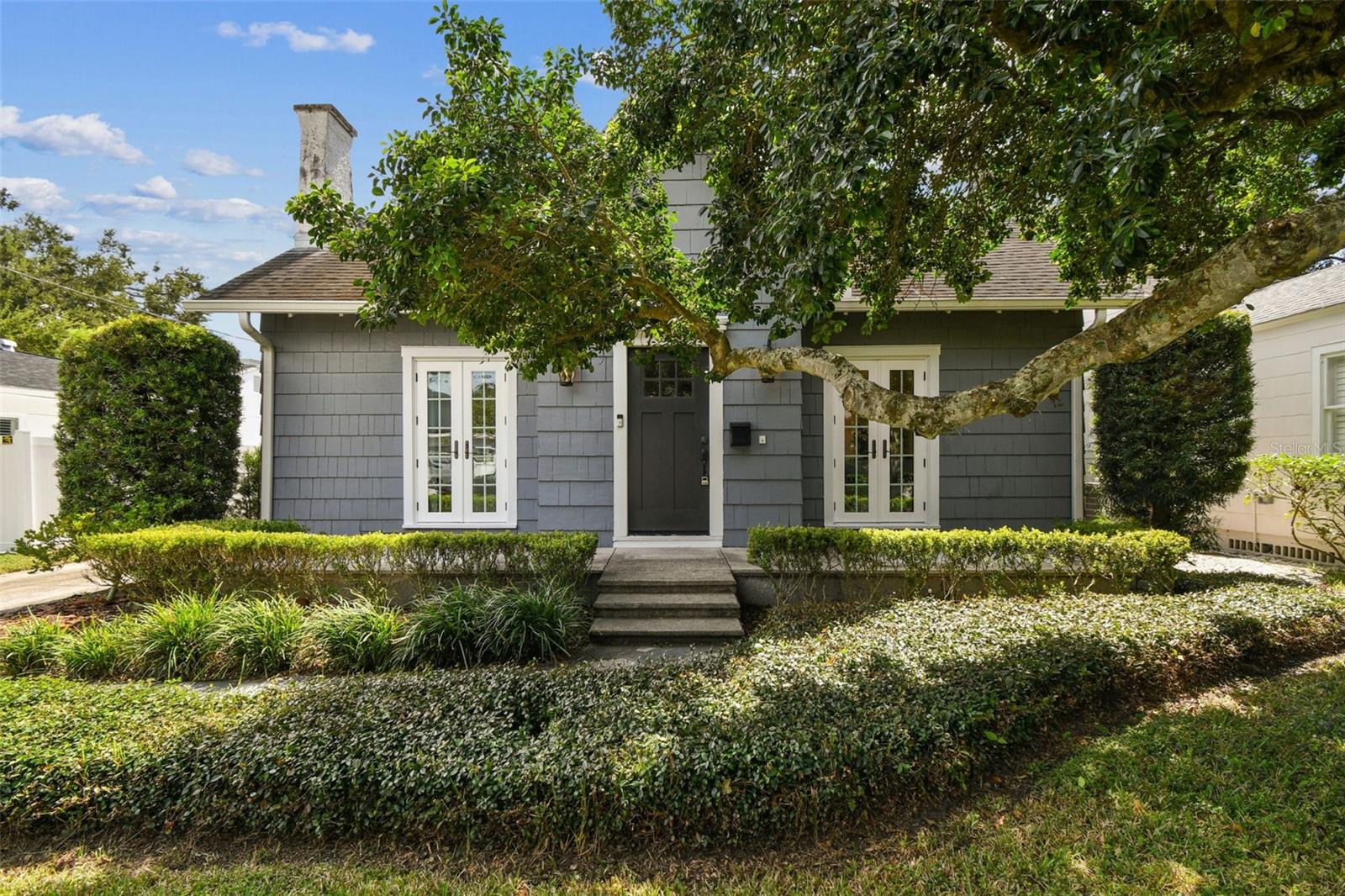 Welcome to 3214 W San Miguel Street, a beautifully updated 2-bedroom, 2-bath home in the heart of Palma Ceia, just steps from the Palma Ceia Golf & Country Club course. This charming residence perfectly blends timeless character with modern upgrades, offering exceptional comfort, style, and an unbeatable location. Bursting with curb appeal, the home’s inviting façade features sets of French doors on either side of the front entry, opening to two welcoming porch areas — perfect for morning coffee or evening relaxation. Inside, natural light fills every room, highlighting the home’s warmth and personality. The spacious backyard provides ample room to expand or add a pool, making it an ideal canvas for future dreams. Situated in an A-rated school district and high and dry with no flood insurance required, this home delivers both peace of mind and prime South Tampa convenience. Thoughtfully maintained and extensively updated, the home has undergone numerous renovations over the years. In 2020, structural enhancements were completed, including new footers, beams, and piers. The following year, new gutters were installed. In 2022, the kitchen was completely remodeled with ceiling-height cabinetry, quartz countertops, and stainless steel appliances, along with fully renovated bathrooms and plumbing updates. In 2023, all windows and doors were replaced, complemented by plantation shutters throughout. More recently, in 2024, a transferable termite treatment was added to the crawlspace and attic, and in 2025, the crawlspace was encapsulated and equipped with a dehumidifier for long-term protection and efficiency. This Palma Ceia gem effortlessly combines classic curb appeal, modern comfort, and a highly sought-after location—a rare opportunity just steps from one of Tampa’s most prestigious golf courses.