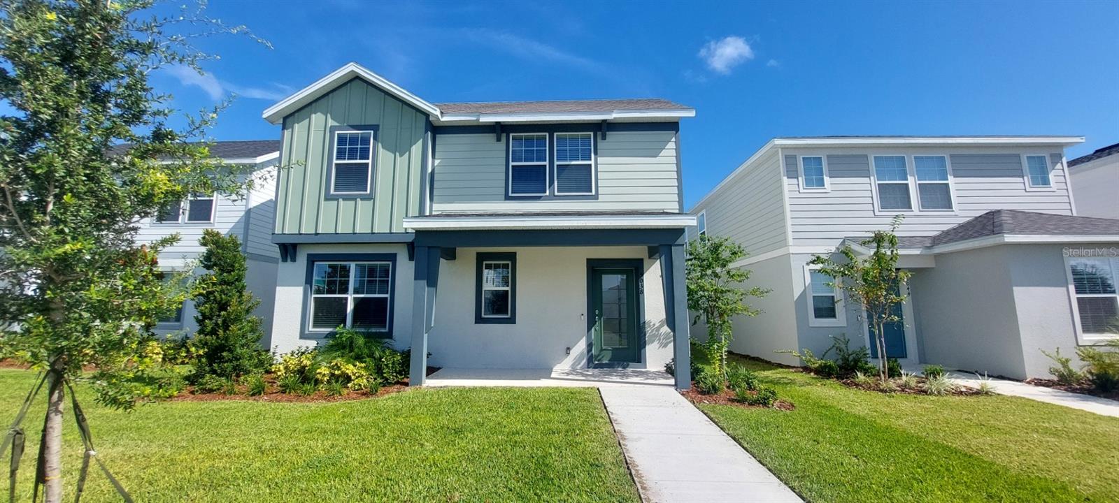 Explore The Landings at Live Oak Lake, a new single-family home community blending city charm with a distinct identity, all without a CDD. Situated between downtown St. Cloud and Lake Nona, it offers private amenities such as a pool & cabana, playground, trails, and playfield amidst serene ponds and conservation homesites. Welcome to the luxurious Mabel bungalow by Pulte, a stunning new construction that perfectly blends modern design with everyday convenience. This Farmhouse-inspired home offers 4 bedrooms, 3 bathrooms, a loft, a covered lanai, and a 2-car rear-load garage. Upon entry, you'll be greeted by a grand foyer with ample storage, including two closets, leading into an open-concept living space. A private hallway off the foyer offers a guest bedroom and full bath, creating an ideal space for visitors. The heart of the home unfolds into a spacious kitchen, café, and gathering room, with seamless access to the covered lanai—ideal for indoor-outdoor living. The chef’s kitchen is a true standout, featuring a large center island, corner walk-in pantry, and Whirlpool stainless steel appliances, including a vented microwave and refrigerator. Elegant Elkins white cabinetry, a decorative tile backsplash, and Lagoon quartz countertops complete the space, ensuring both style and functionality. Upstairs, the luxurious owner’s suite provides the perfect retreat, tucked at the rear of the home for ultimate privacy. The spa-inspired en suite bathroom boasts a glass-enclosed shower, a quartz-topped dual vanity, and a spacious walk-in closet, creating a sanctuary of relaxation. Two additional bedrooms, sharing their own dedicated hallway, offer added privacy and comfort, while a full bathroom serves the space. The second floor also includes two linen closets, a laundry room, and a large loft area—ideal for flexible living. Thoughtful luxury touches throughout the home include porcelain tile flooring on the first floor (except the first-floor bedroom, which features plush, stain-resistant Shaw brand carpeting), carpeting on the staircase and second-floor bedrooms, and pre-wiring for pendant lighting. Smart technology features like a smart thermostat, smart doorbell, and additional LED downlights ensure this home is as advanced as it is beautiful. For added convenience from day one, this home comes complete with 2" faux wood blinds, as well as a washer and dryer! This exquisite home offers the ultimate in luxury, convenience, and modern design—everything you need to live and relax in style.