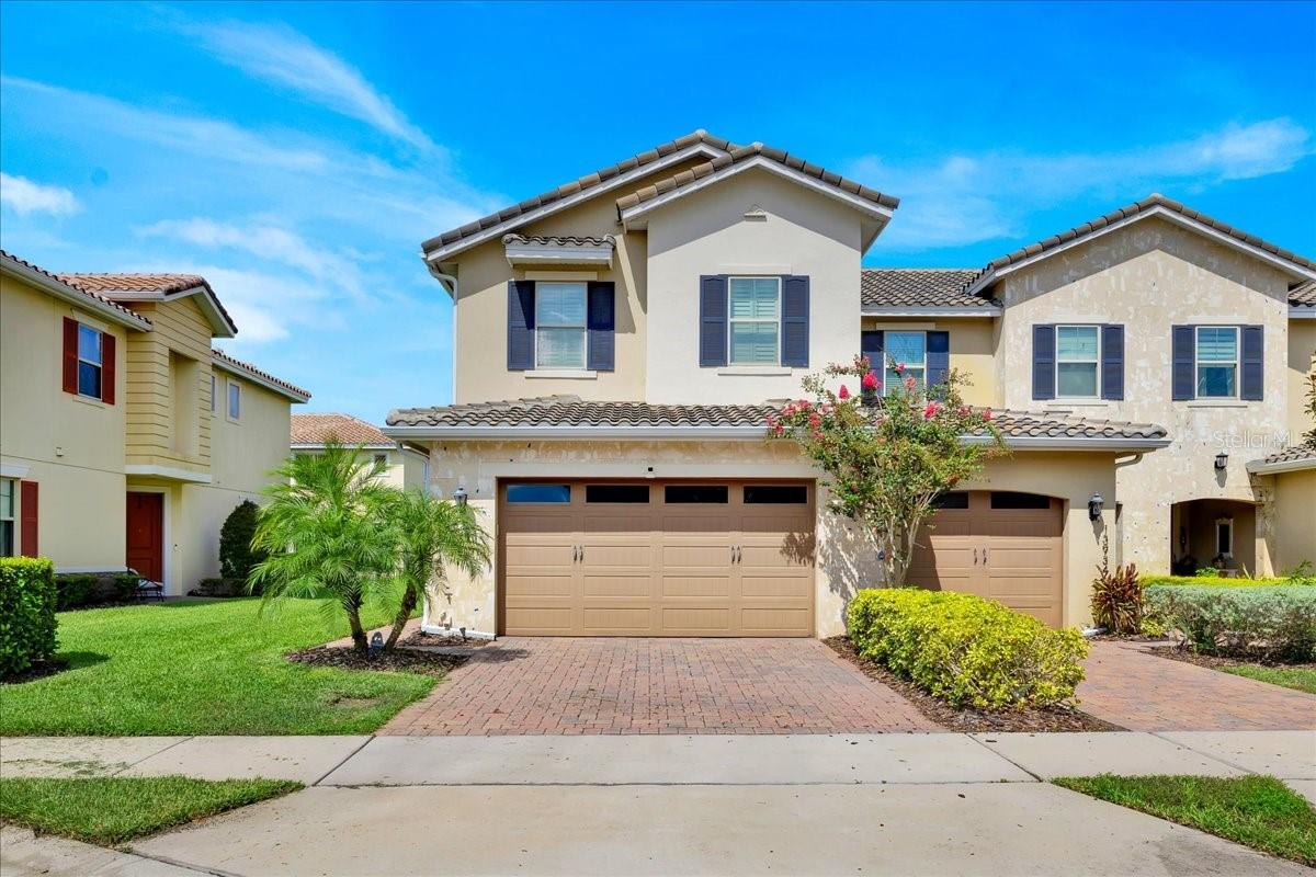 Discover the perfect blend of comfort, convenience, and community living in this 3-bedroom, 2.5-bath, 2-car garage END-UNIT townhome located in the highly desirable, 24-hour guard-gated neighborhood of Eagle Creek. Built in 2017 and thoughtfully upgraded, this residence offers both style and functionality with no CDD fees. Step inside to find an inviting open-concept layout filled with natural light. The chef-inspired kitchen features solid wood shaker cabinetry with crown molding, a decorative backsplash, large island with pendant lighting and seating, reverse osmosis water filtration, and an extended walk-in pantry for abundant storage. Stainless steel appliances have been recently updated, and a stylish lighting package ties it all together. The main level also includes a convenient half bath and flows seamlessly to the screened paver lanai with electric shade—perfect for relaxing or entertaining. Throughout the home, you’ll find plantation shutters, tile and commercial-grade laminate floors, and smart home features. Additional upgrades include an insulated garage door (2024), garage storage racks (2020), Nest thermostat (2023), and a whole-home water softener. Upstairs, a spacious loft with hidden storage anchors the bedrooms. The primary suite is a private retreat with tray ceiling, a custom feature wall (added in 2024), en-suite bath, and walk-in closet with a built-in organizer system. Two additional bedrooms share a full bath, while the laundry room is conveniently located near all bedrooms. Eagle Creek residents enjoy a wide variety of amenities including resort-style pools, fitness center, clubhouse with restaurant, golf course, tennis and basketball courts, and playgrounds. Families also benefit from zoning for top-rated schools. The community’s prime location places you just minutes from Lake Nona’s Medical City, VA and Nemours hospitals, shopping, dining, recreation, and Orlando International Airport, with quick access to SR 417 and Narcoossee Road. This is a low-maintenance lifestyle with every luxury already in place—schedule your private showing today!