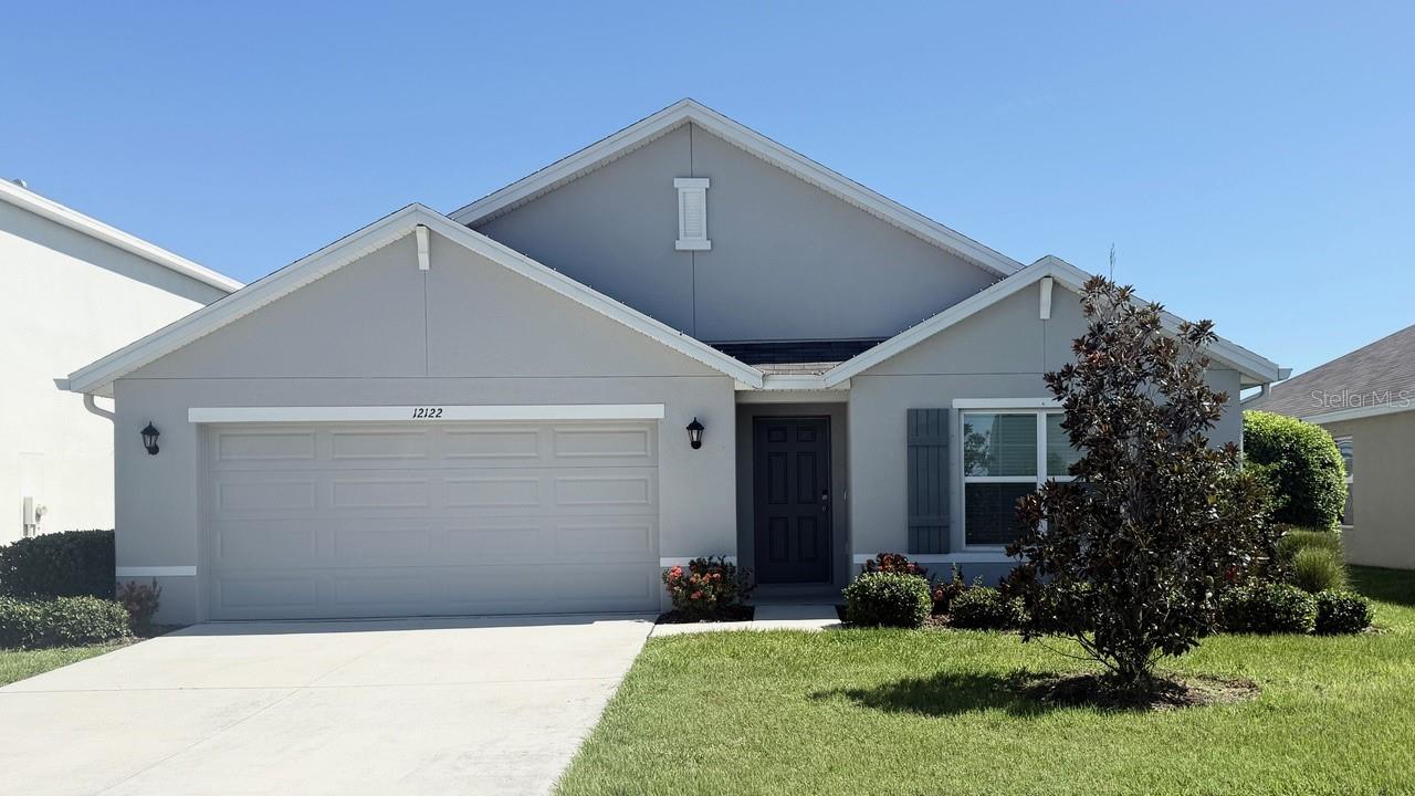 Welcome to this beautifully designed one-story home located in the desirable Bella Lago community in Parrish, FL. Featuring a spacious open-concept layout, this home effortlessly combines style and functionality. The well-appointed kitchen, equipped with modern appliances—including a refrigerator, built-in dishwasher, electric range, and microwave—flows into the living and dining areas, creating an ideal space for both relaxation and entertaining.
The private owner's suite, tucked at the back of the home for ultimate privacy, boasts an ensuite bathroom, a large walk-in closet, and an additional built-in closet. Two additional bedrooms are conveniently located near the second bathroom, making it perfect for family or guests. A third bedroom, situated near the laundry room, offers easy access to the included washer and dryer.
Step outside to the covered lanai or enjoy the serene lake view from your decorative paver patio, an ideal setting for peaceful outdoor living. On warm sunny days, take a short walk to the community's resort-style pool, fitness center, playground, and dog park.
Located in the Bella Lago community, this home provides easy access to local parks, shopping, dining, and top-rated schools. It offers the perfect blend of comfort, convenience, and Florida living.