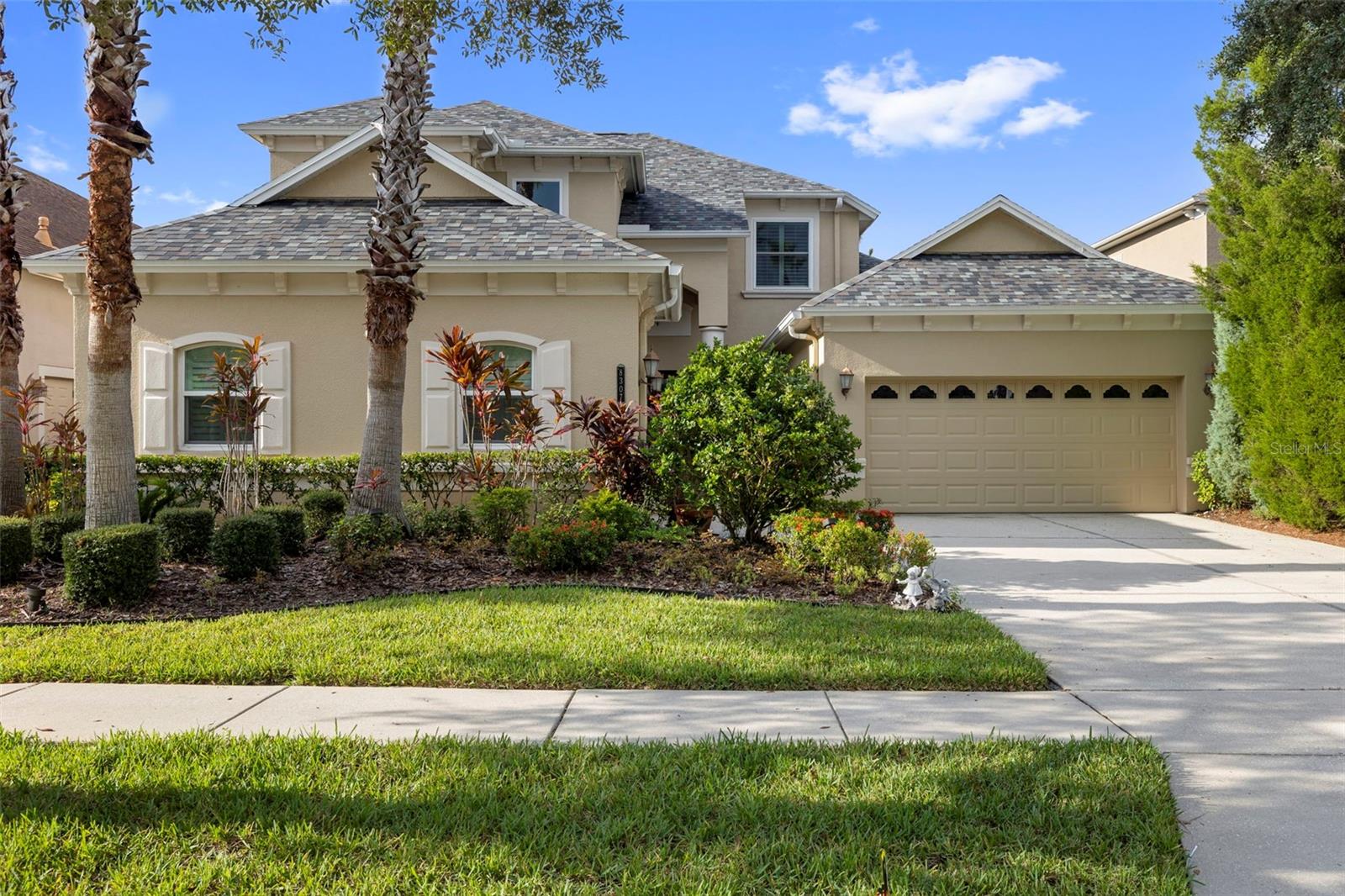 Located in the highly sought-after guard-gated Grand Hampton community, this stunning 4-bedroom, 3.5-bath home offers 3,311 sq. ft. of elegant living space and a 3-car garage. Meticulously maintained landscaping and serene pond views set the stage for an impressive arrival.
Step through a beautiful glass-paneled, wood-framed front door into a light-filled foyer accented with architectural columns and crown molding throughout. Just off the entry, a formal dining room with a chandelier creates the perfect setting for gatherings. Adjacent to the dining room is the formal living room, featuring sliding glass doors that lead to the outdoor living space.
The chef’s kitchen is a true centerpiece, complete with stainless steel appliances, gas range with center island, granite countertops, tile backsplash, and an abundance of solid wood cabinetry. An eat-in kitchen area offers relaxing pond views, while modern and recessed lighting adds a sophisticated touch. Just beyond the kitchen, the spacious family room boasts coffered ceilings and custom built-in features. A dedicated office, laundry room, and a convenient half bath are also located on the main level.
The primary suite on the first floor is a private retreat, featuring large windows letting in an abundance of natural light, a generous walk-in closet, and a luxurious en suite bathroom with granite countertops, dual vanities, a garden tub, and a walk-in glass shower.
Upstairs, an expansive loft opens to a private balcony, ideal for enjoying peaceful views or creating a versatile entertainment space. Three additional bedrooms and two full bathrooms provide ample comfort for family or guests.
The outdoor area includes a covered patio perfect for relaxing while taking in tranquil pond views. Grand Hampton residents enjoy resort-style amenities, including a clubhouse, fitness center, swimming pools, playgrounds, walking trails, and more—all within a short drive to shopping, dining, and top-rated schools.
Don’t miss the opportunity to lease this beautiful home in one of Tampa Bay’s most desirable communities!