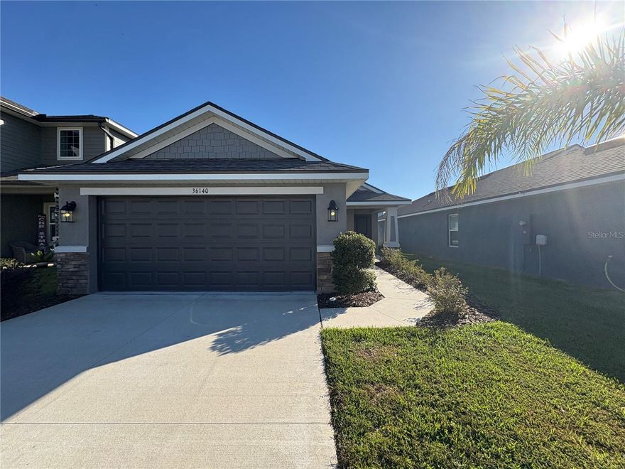 Welcome to this beautifully crafted single-story home located in the desirable Abbey Glen community. Modern and bright,  this newly built residence offers a comfortable blend of style and function.
Inside, you’ll find an inviting open-concept great room accented with sleek porcelain tile flooring, while the bedrooms feature soft, plush carpeting. With 3 bedrooms, 2 baths, and approximately 1,415 sq. ft., the floor plan provides both versatility and a natural flow ideal for everyday living or entertaining.
The spacious kitchen stands out with its expansive island featuring breakfast bar seating and beautiful custom cabinetry, all opening seamlessly into the main living area to create a perfect gathering space.
The private primary suite offers a generous en-suite bathroom complete with dual sinks and ample counter space. Additional conveniences include an interior laundry room and a two-car garage.
A covered patio overlooks the fenced yard, ideal for outdoor enjoyment.