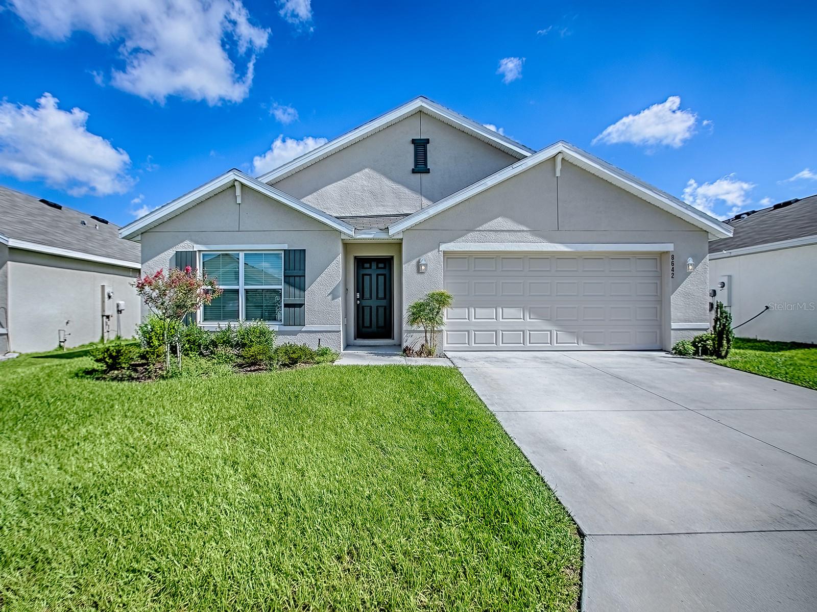 Welcome to the neighborhood Triumph. This 4-bedroom, two bath Cali Model house has a great open floor plan. Kitchen has espresso color cabinets with Granite counter tops. Many upgraded features have been added by the seller since moving in. Starting with a fenced backyard with irrigation. A screened lanai that faces east for your morning coffee, and to enjoy in the evening without the hot afternoon sun. Ceiling fans with light have been installed. Master shower features glass shower doors. The house is equipped with Smart home system. The Triumph neighborhood does not have a CDD or Bond like others in the area. This seller has a VA Assumable loan at 2.99 for Veterans or Non-Veterans*. If location is a factor for you, this could be the house for you. Florida Turnpike and I-75 within just minutes, along with over 20 restaurants, Lowe’s, Home Depot, Publix, Winn-Dixie, New Target store and The Villages. Give me a call today to walk through a great house.
