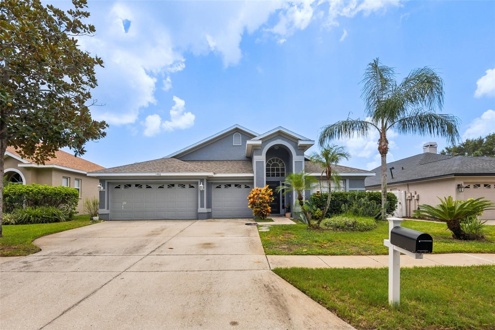 Situated in the private, gated North Lake community of Tarpon Springs—featuring two entrances, a pier on Salt Lake, and a dock on Leisure Lake—this spacious 3-bedroom + flex/office room, 3-bath home with a 3-car garage offers the perfect mix of comfort, nature, and convenience. Enjoy water activities, nearby parks, and access to the Pinellas Trail for biking or hiking, all just minutes from beaches, the Sponge Docks, shopping, dining, and a sports complex. Inside, the open floor plan connects to a screened saltwater pool surrounded by tropical landscaping, with solid wood cabinetry, granite counters, glass appliances, and a large kitchen island overlooking the patio. With two primary suites, walk-in closets with personalized cabinets and shelving, a dedicated pool bath, and a garage outfitted with a fridge, sink, and opener—this home is both functional and relaxing. Tile flooring throughout the bedrooms, a newer water heater, roof (2022), pool salt system (2022), exterior paint (2020), and brand-new HVAC (2025) make it truly move-in ready. Irrigation system, front-load washer/dryer, and full access to the boardwalk and lake dock complete the package! Don't miss this opportunity, schedule your showing today!