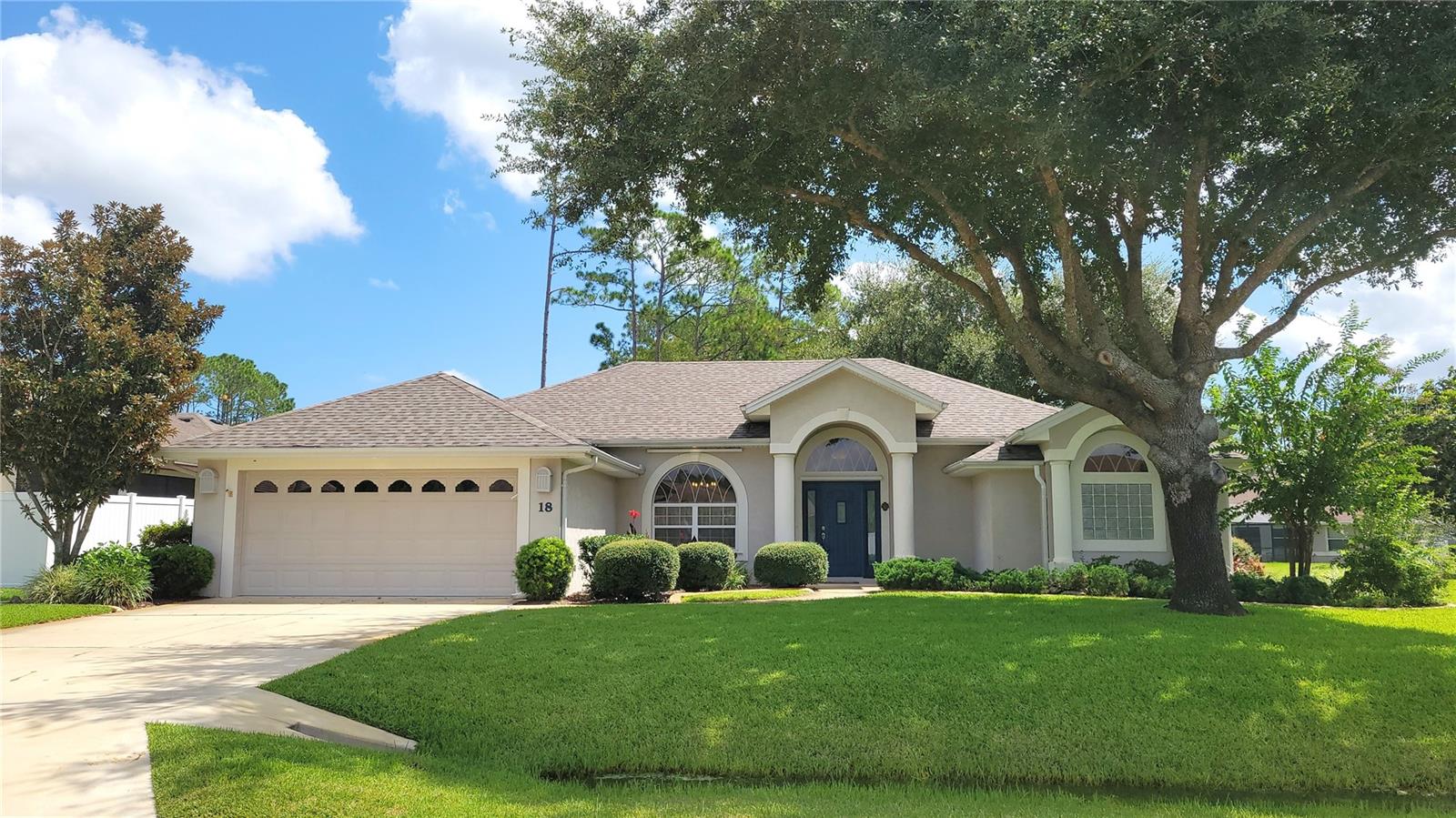 This custom-built block home in Palm Coast radiates timeless elegance and thoughtful design. From the moment you step inside, you're greeted by large picture windows, decorative arches, crown molding, and lighted plant shelves that add charm and sophistication throughout. The formal living and dining rooms offer refined spaces for entertaining, while the tandem garage provides ample room for vehicles and storage. Triple sliders open to a spacious, trussed porch that is both covered and screened, overlooking a lush, privacy-fenced backyard with vibrant green grass — a picturesque setting for gatherings or quiet relaxation. Recent updates include a new water heater installed in August 2025, and a roof that’s only 3 years old, adding peace of mind to the home's impressive list of features. Every detail of this home has been executed to perfection, showcasing what true custom craftsmanship looks like. Come experience the style, comfort, and beauty this stunning residence has to offer.