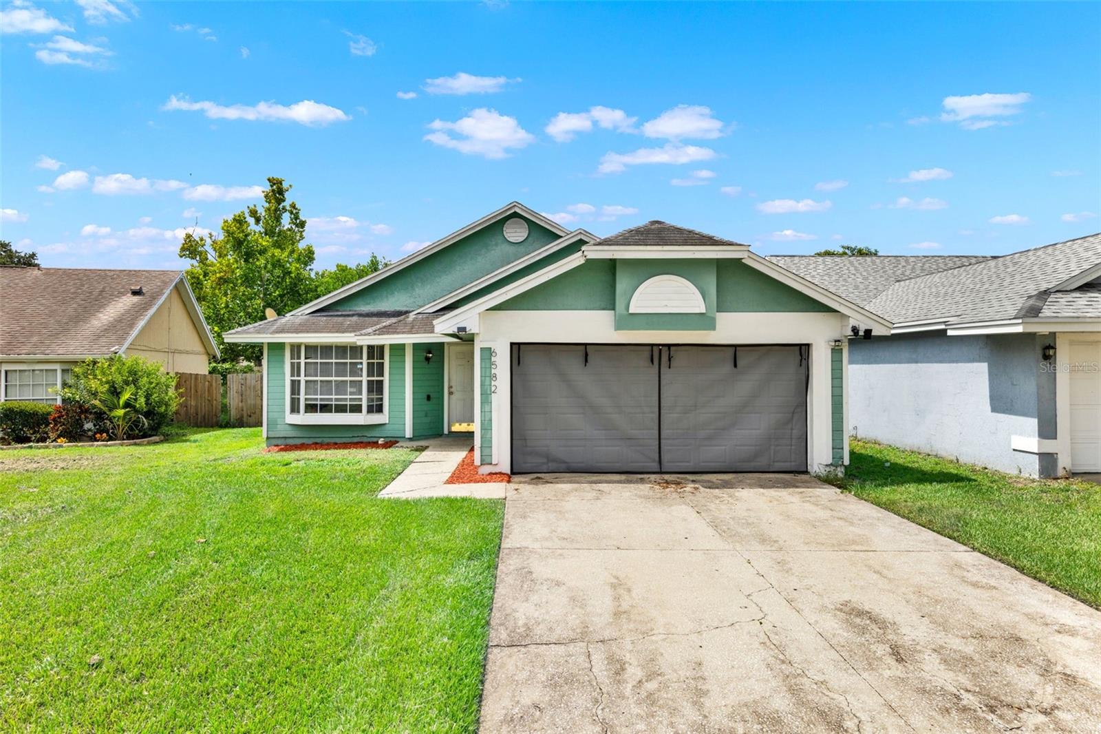 Welcome to this charming and inviting 3-bedroom, 2-bathroom single-family home, ideally situated in Orlando's desirable Hiawassee Point subdivision. Built in 1990, this one-story residence offers 1,570 sq ft of comfortable living space on a generous 7,652 sq ft lot. Enjoy the benefits of a very LOW HOA FEE, a spacious attached 2-car garage, and an impressive 4-car driveway. Step inside to an open living space, perfect for relaxation and gatherings, which seamlessly connects to a completely renovated kitchen. The kitchen showcases granite countertops, STAINLESS STEEL APPLIANCES, and a stunning granite waterfall island – ideal for entertaining and effortlessly flows into the dining area with sliding glass doors. The owner's suite is large enough to accommodate king size furniture and the bathroom provides a luxurious escape with its elegantly stoned shower. The vaulted ceilings enhance the home's airy, expansive feel.
Enjoy peace of mind with a host of recent upgrades, including a full house repipe in 2020, a new digital smart water heater installed in 2024, and hurricane-proof sliding glass doors replaced in 2024 for ultimate protection. The garage door screen gives you the added protection from bugs. The fully fenced yard offers privacy for backyard gatherings and a safe haven for everyone and pets.
LOCATION, LOCATION, LOCATION! Located in West Orlando, this home provides easy access to local amenities, shopping, dining, and entertainment. Commuting throughout Central Florida is a breeze with close proximity to Hwy 441 and the 408, placing you just a 20-minute drive to downtown Orlando, and 30 minutes to Orlando International Airport and Universal Studios.
This property offers the perfect blend of comfort and affordability, making it a great purchase for a first home or an investment opportunity. Don’t miss your chance to own this fantastic home in a prime location! Schedule your showing today!