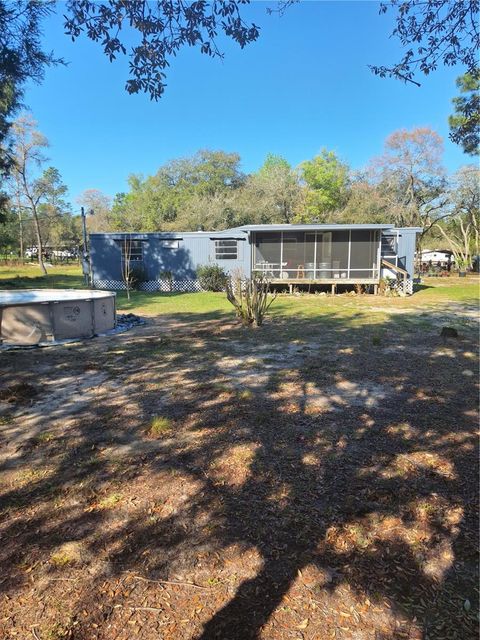 Photo of 150 NE 139th Terrace, Williston, FL 32696 (MLS # OM720683)