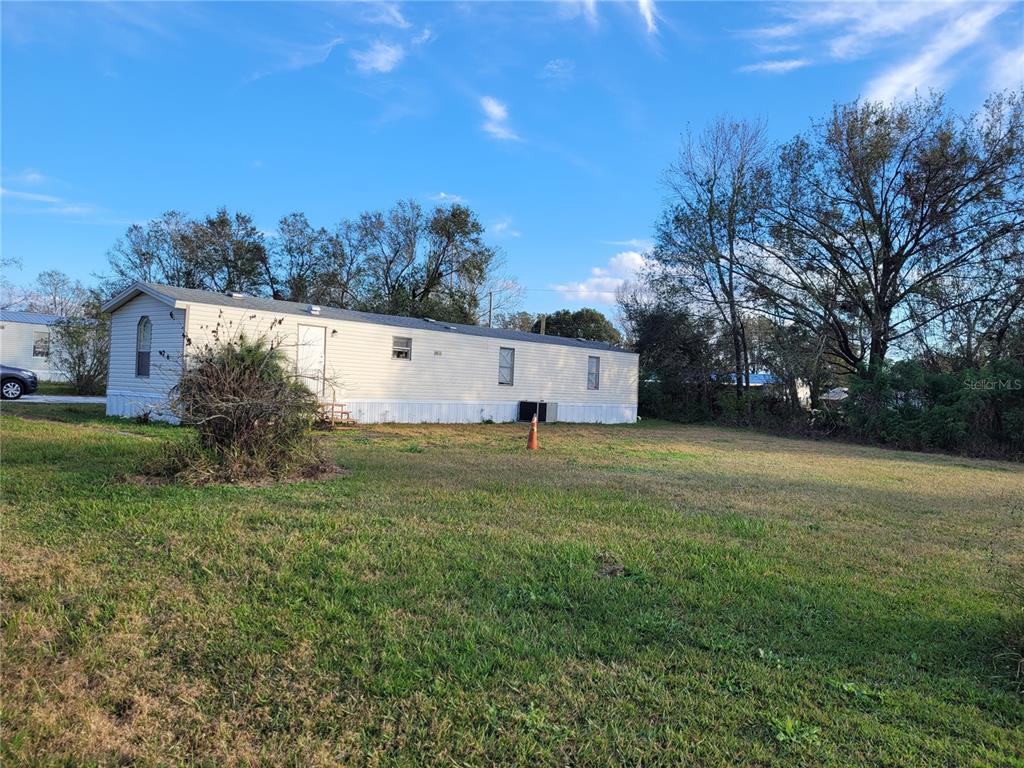 Fabulous 2/2 mobile home 14 wide by 68 long with a great split floor plan on over a quarter acre on the end of a quiet dead end street with no HOA. The lot is 90 feet wide by 125 feet deep - plenty of room to enjoy peace and quiet and have room to park a boat and RV. The home has an extra large master bedroom as well as a very large eat in kitchen and a great open floor plan with vinyl plank flooring throughout the home for easy care. Great home! Call to schedule your showing today!