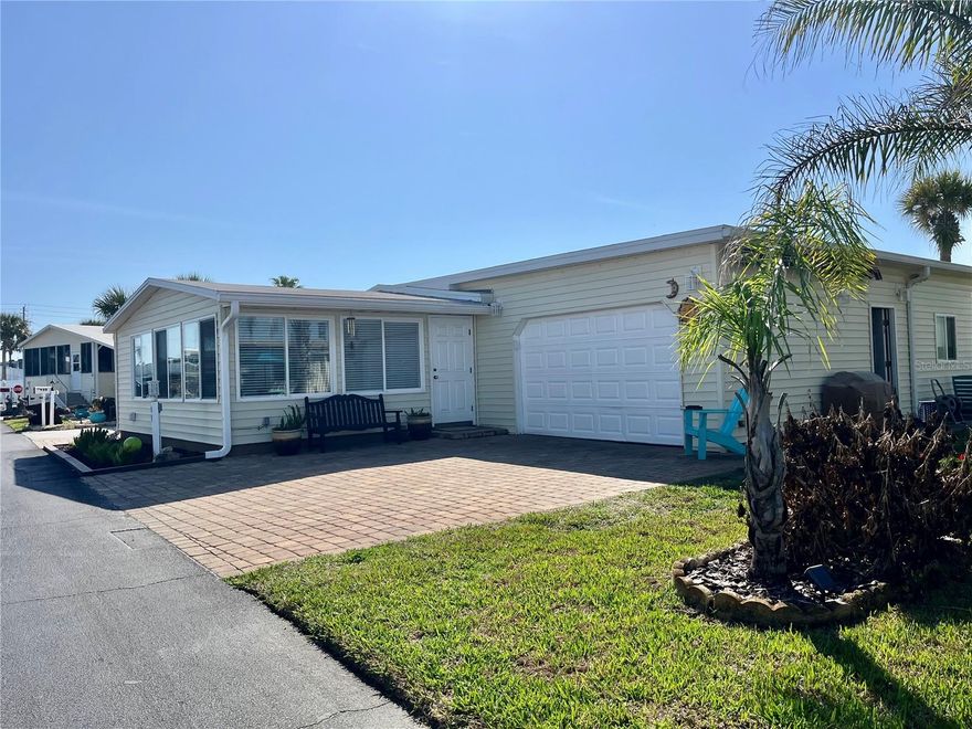 This is the one you’ve been waiting for at the beach! This home was fully renovated in 2022, it is furnished and move-in ready! Offering 1344 sqft, 2 bedroom and 2 full bathrooms. Bright, open floor plan with an extra-large kitchen featuring an abundance of solid wood cabinetry, you will not run out of space here! The expansive granite countertops, and a massive island with a cooktop and eating bar are perfect for not just cooking but entertaining as well. The dining area and home office share this beautiful space for flexible living and full enjoyment of your home. Spacious living room offers an ideal spot to relax after a day at the beach or community pool, with over flowing natural light throughout. Large, bright bedrooms and fully renovated bathrooms with neutral finishes and exquisite flooring create a calm, contemporary feel everywhere you look. The Mini-split A/C systems will provide extra comfort in every room. But wait there’s more! You will also find a rare 640 sq ft garage! lt is large enough for a small boat, jet ski, motorcycles, or that special car you want protected from salt air. If you like to tinker there are plenty of built in cabinets for your home work shop. Paver driveway will fit two cars, with more pavers surrounding the home for a neat, low-maintenance exterior. Roof, A/C, Water Heater, electrical and plumbing also 2022. A lovely side garden completes this picture-perfect coastal property. Located in Surfside Estates, an active 55+ resident-owned land-share community with no lot rent. Your purchase includes a share of the community; $220/month maintenance covers Wi-Fi, cable, yard maintenance, management, and facility access. Community amenities: heated/cooled inground pool, fitness room, library, shuffleboard court, rooftop deck, kayak storage, BBQ pit, gazebo on the Intracoastal, and a very active Social Club offering potlucks, holiday dinners, bingo, card games, pool tables, exercise classes, water aerobics. Walk to the beach across the street or bike/golf cart to one of two docks for fishing, watching the boats and dolphins go by or simply enjoying beautiful sunsets every evening. The quaint neighboring City of Flagler Beach is just minutes away with a variety of restaurants and shops to choose from. Conveniently just over the bridge you will find more shopping, doctors and hospitals. You can move right in and start enjoying beach life today!