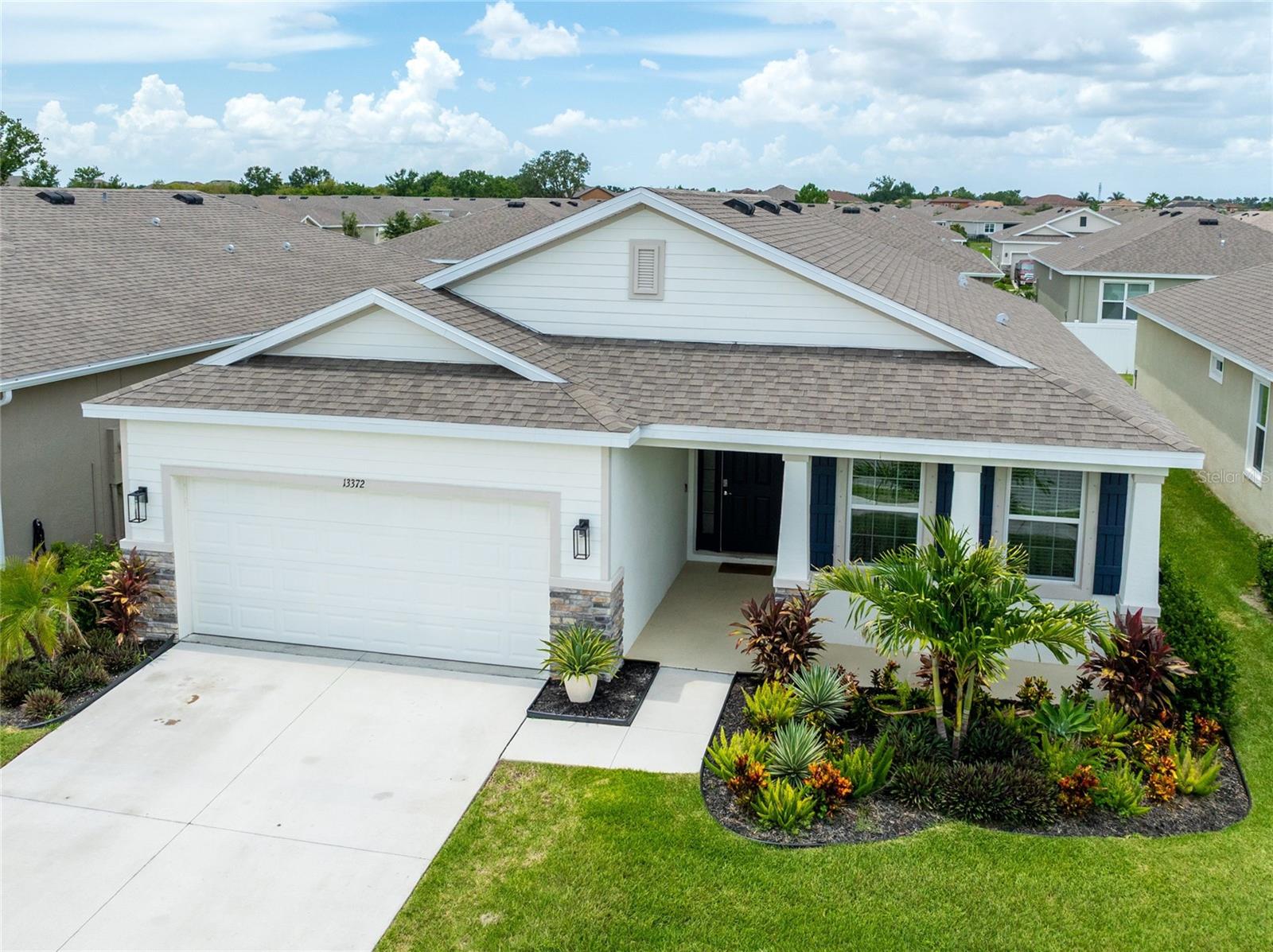 Why build a new home when you can purchase a nearly new one with numerous upgrades already implemented by the current owners? Welcome to your dream home in the heart of Waterleaf, one of Riverview’s most sought-after master-planned communities! This immaculate 3-bedroom, 2-bathroom home on cul-de-sac offers a perfect blend of modern comfort and timeless design. From the moment you arrive, the home’s gorgeous curb appeal draws you in—with manicured landscaping, and an inviting entryway that sets the tone for what’s inside. Step into the elegantly designed kitchen and living combo space with 9 ft ceilings, custom built entertainment center and plenty of natural light. The kitchen is any chef's dream! It features waterfall quartz countertops, stainless steel appliances, a large pantry, and gorgeous wood cabinets. Sliding doors off the living room take you to your open patio space, where you can enjoy the fresh air or grill out. The primary bedroom has a walk-in closet with custom-built shelves. The owner's suite bathroom features double sinks, granite countertops, a garden tub, and a shower. Faucets, mirrors and hardware have been recently upgraded to incorporate a luxury spa ambiance. Two secondary bedrooms are located at the front of the home and share a second bathroom. Custom upgrades include: new luxury vinyl flooring throughout the home, new fan in the family room, a chandelier in the owner's suite, recessed lighting in the garage, whole house water softener, custom-built shelves in the second bedroom closet, GE front control electric range with the power boil burner and a warming zone, and so popular microwave drawer that integrated seamlessly into cabinetry offering a more modern aesthetic. The backyard features lovely landscaping improvements while adding some privacy, one less task for prospective buyers. And the cherry on the top is this home comes with the washer and dryer! *** HOA fee includes cable and lawn care *** This Gated community offers walking trails, a community pool, a playground and dog park. Do not miss this unparalleled opportunity to own a magnificent home, call today to arrange your private showing!