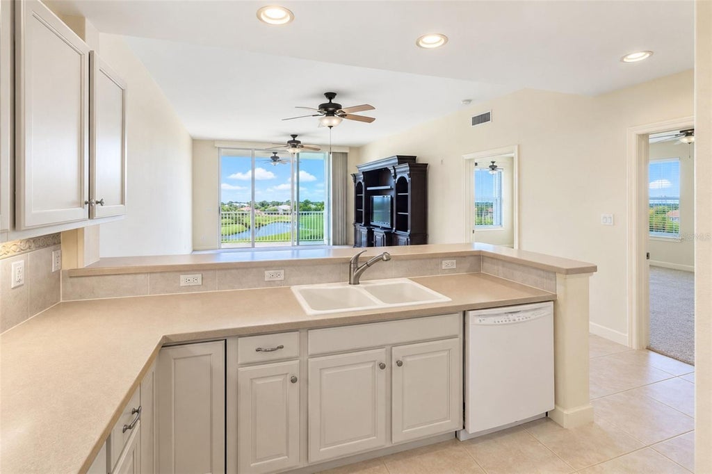 Photo of 10055 Links Lane #406, Rotonda West, FL 33947 (MLS # D6149135)