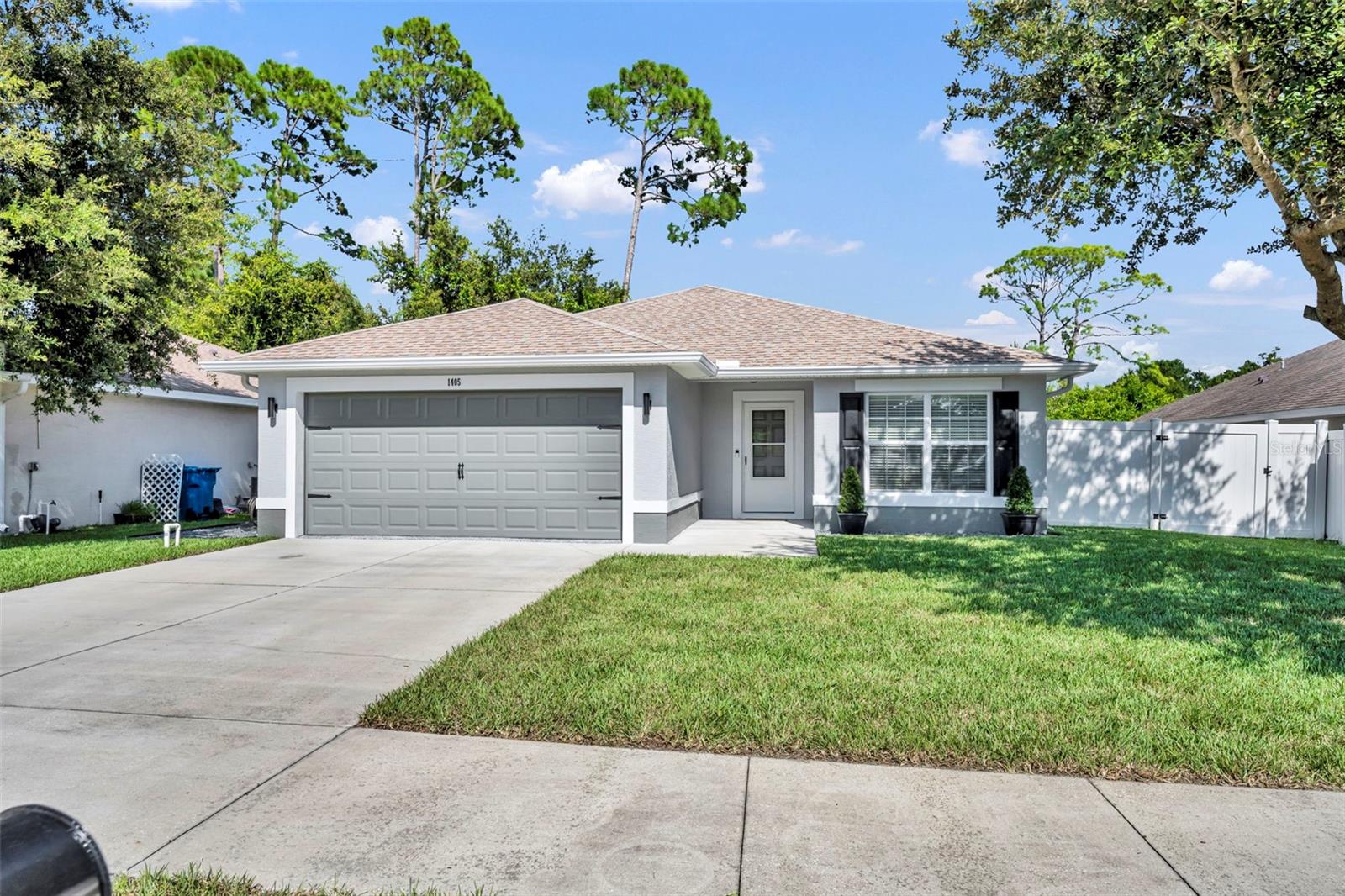Are you Ready? The neighbors are excited to welcome the new owners of this beautifully remodeled home. Quiet street, no through traffic, private neighborhood. Every inch of this home was remodeled with care and attention to detail. The kitchen is equipped with top-of-the-line stainless steel appliances, refinished cabinets in stunning Cobalt Blue, gold hardware, sparkling white quarts countertops and tile backsplash. Luxury plank vinyl and ceramic tile throughout the home, making it easy to clean and hypoallergenic. As you can tell from the photos, the master bathroom is clean, simple and bright with a pop of cobalt blue from the dual sink vanity. For the car enthusiast, the garage has freshly epoxied floors and its own mini-split air conditioning system. Shouldn't every Florida garage have AC? The fire pit area in the back is ready for late night gatherings and smores. The yard has fresh St. Augustine sod and minimalist, modern, low maintenance landscaping which will surely make the neighbors green with envy. All you need to bring is your furniture and a bottle of champaign to celebrate your new HOME.