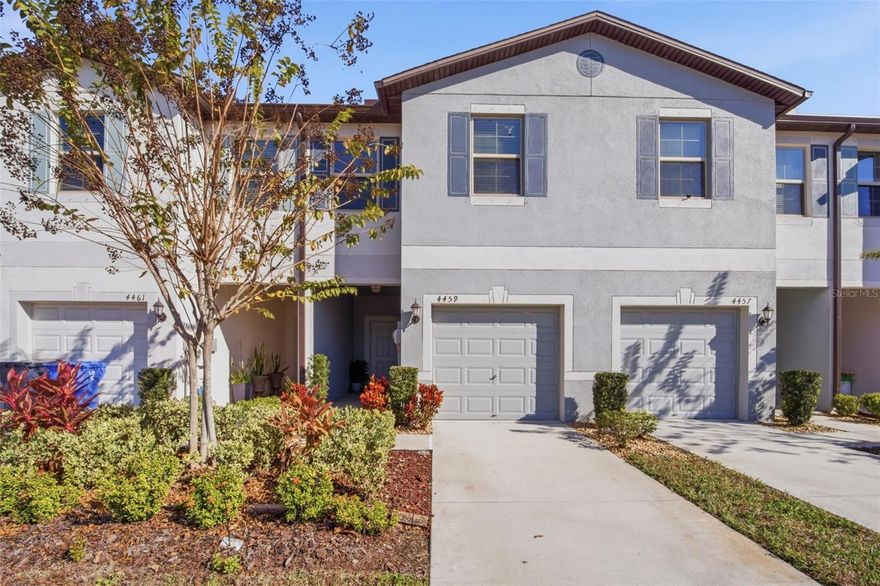 Over $15,000 in UPGRADED features in this Better-than-New townhome located in the heart of Tampa!  Perfect for investors as an income producing property, families or first time home buyers, this low maintenance, energy efficient, 1663 sf townhome is ready for new owners. Built by Lennar in 2022, featuring 3-bedrooms, 2.5-baths, this residence is ideally situated in the Touchstone Community, with easy access to Tampa’s top attractions... including major sports venues, theaters, medical facilities, airports and the area's stunning Gulf beaches! Step inside to a living and dining area that flows into an Open, bright kitchen featuring white cabinets, stainless pulls, breakfast bar and an eat-in dining space with sliding doors to screened lanai offering private backyard views. Upstairs, you'll find a versatile loft with a desk area, perfect for a home office or study space. The generously sized owner’s retreat with a separate seating area, closet organizers and an upgraded ensuite bathroom featuring dual sinks and stylish finishes. Secondary bedrooms are located on the opposite side of the loft, ensuring comfort and privacy for guests and family with a full bath on the same wing. Upstairs also includes a convenient laundry room, located between the bedrooms, with storage cabinets installed above the washer and dryer. Additional features include energy-efficient double-pane windows, a one-car garage with an Electric vehicle charger and powder room with a pedestal sink on the main floor. The HOA takes care of lawn maintenance and building insurance, and provides access to community amenities such as a clubhouse, swimming pool, fitness center, splash pad, playground, dog parks, open spaces and a calendar full of social events and onsite activities. Just minutes from Brandon Mall shoppes, Downtown Tampa, Selmon expressway, Tampa International Airport, MacDill Air Force Base and major highways for easy commutes from this Move-in-ready townhome, in one of Tampa’s most sought-after locations!  CALL TODAY!