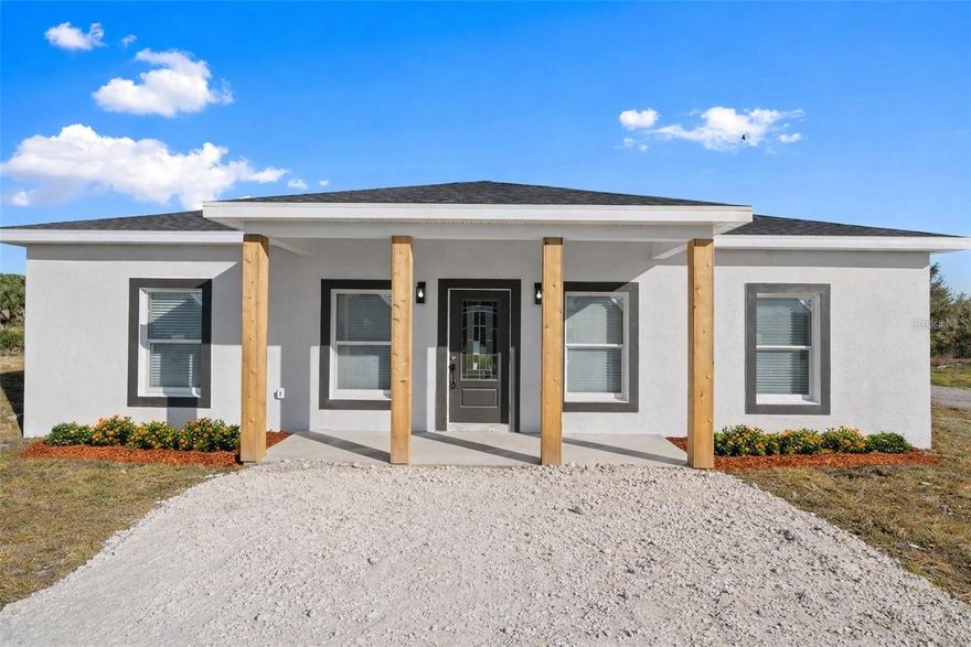 Brand-new 2025 CBS construction on 1.25 fully fenced acres in Okeechobee! This move-in ready 3-bedroom, 2-bath home offers the perfect blend of modern finishes and country freedom. Zoned Residential/Agricultural with no HOA, there’s plenty of room for animals, boats, RVs, a barn, workshop, or future garage. Inside, you’ll find a bright open-concept layout featuring quartz countertops, solid wood cabinetry, stainless steel appliances, laminate flooring throughout, and beautifully tiled bathrooms. The split-bedroom floor plan provides privacy, while the spacious living area is ideal for everyday living and entertaining. Enjoy peaceful rural living with the convenience of nearby paved road access. Situated in Flood Zone X. This property is ready for immediate occupancy — no waiting to build.