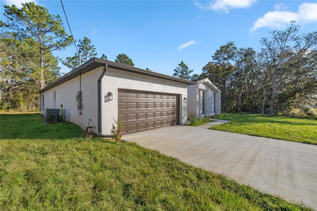 Photo of 1861 W Hamshire Blvd, Citrus Springs, FL 34434 (MLS # O6331163)