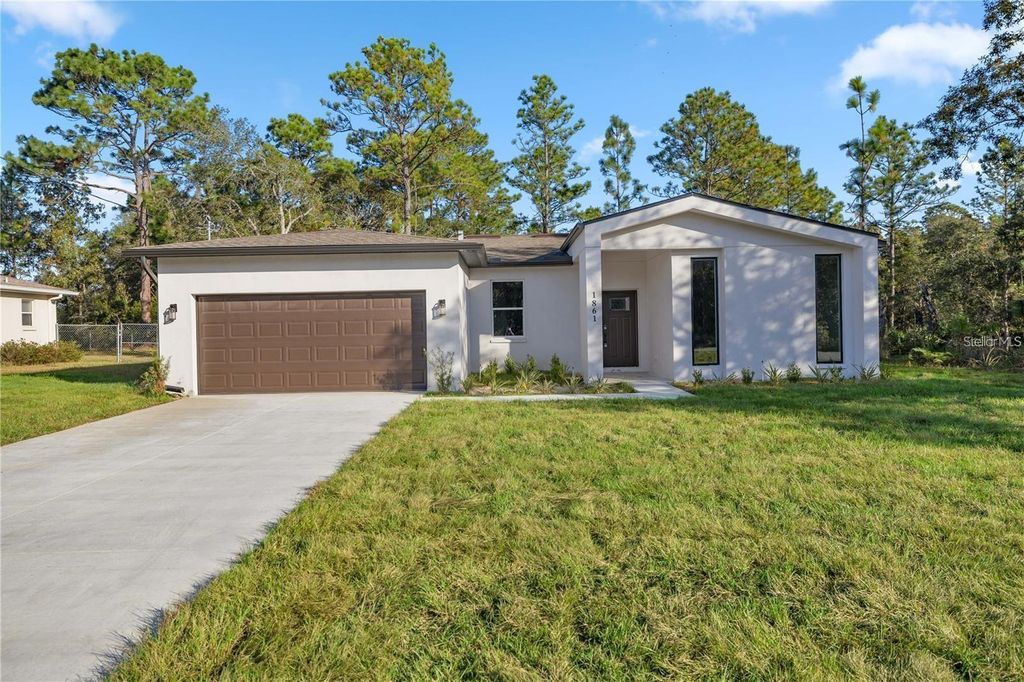 Photo of 1861 W Hamshire Blvd, Citrus Springs, FL 34434 (MLS # O6331163)
