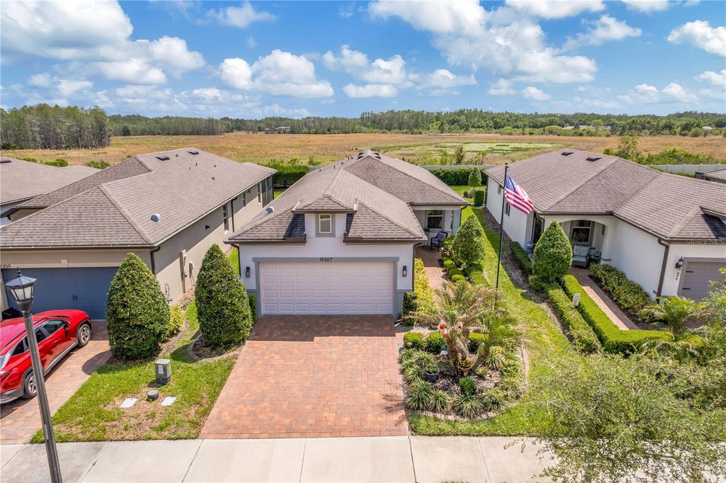 Photo of 19367 Coastal Shore Terrace, Land O Lakes, FL 34638 (MLS # TB8491769)