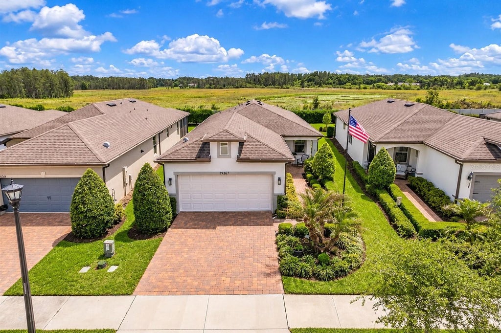 Photo of 19367 Coastal Shore Terrace, Land O Lakes, FL 34638 (MLS # TB8491769)