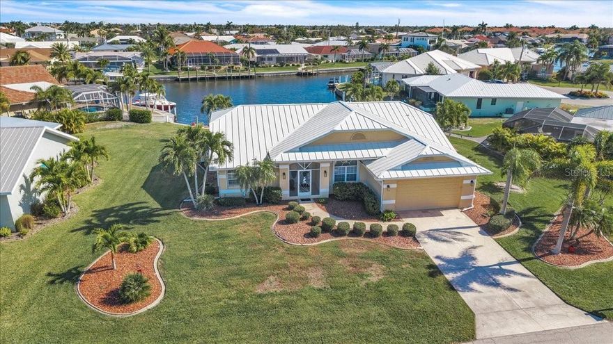 Experience the best of waterfront living in this exceptional Punta Gorda Isles home, perfectly positioned on a quiet cul-de-sac with an oversized 0.3+ acre, sailboat-access lot. Privacy, space, and sweeping deep-water canal views set the tone for a property that truly checks every box.

Inside, the open-concept, split-floor plan offers three bedrooms, two bathrooms, and over 2,000 sq ft of bright, airy living space. Cathedral ceilings create an impressive sense of volume, while abundant storage and generous walk-in closets enhance everyday comfort. Thoughtful updates throughout mean the home is completely move-in ready. Additional peace of mind comes from no hurricane damage, a full-house generator, and a new AC system installed in 2025.

Step outside to your private waterfront oasis. The screened pool area overlooks Kingfisher Lagoon, a wide, deep canal with a city-maintained concrete seawall. Boaters will appreciate immediate sailboat access with no bridges, placing you just minutes from Charlotte Harbor. The private dock, equipped with electric, offers room to add a lift—or simply keep your sailboat in the naturally deep, lagoon-like water with no dredging concerns.

Located near the end of the canal system in highly desirable Punta Gorda Isles, this home offers quick access to open water, downtown Punta Gorda, and is a short bike ride to Ponce de Leon Park. Forget the public ramps—your waterfront lifestyle begins right in your own backyard.

This property delivers the ideal blend of comfort, location, and true boating convenience. A must-see for anyone seeking the ultimate Southwest Florida waterfront home.