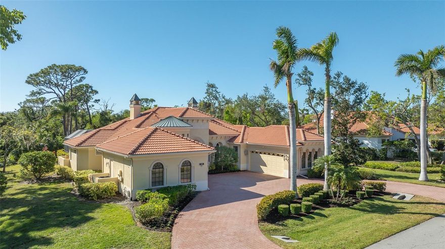 This stunning 5 bedroom, 4 bath residence, custom built by Wetherington, epitomizes refined living and sophisticated elegance. Nestled in The Oaks Clubside, it enjoys an incredible private setting, with no house or neighbors on one side. This home is large and spacious, with timeless design elements, creating an exquisite sanctuary. As you enter through the double leaded glass front doors, the open formal dining area is on your right.  In front of you, the elegant formal dining room with fireplace, and a lovely view out to the pool.  As you explore, you will be impressed by all the details you find throughout, tray and coffered ceilings, built-ins, unique ceiling fans and lighting fixtures, plantation shutters and tile work.  The kitchen earns a chef’s kiss.  Here you will find everything the home gourmet needs to create stunning meals with enough space to enjoy them with guests at the adjourning eat-in area.  There are two master suites, connected by a spectacular bathroom, reminiscent of space you would find in a five-star hotel. The walk-in closet is huge with built-in features. The interior of this home is so inviting you may not want to leave. However, once you step outside your breath will be taken away.  You will find an amazing addition to the inside, a fabulous outdoor family room, complete with fireplace and kitchen area.  Covered, this is the perfect spot to enjoy some shade on a sunny afternoon, or to cozy up on a cool Florida evening. Completing the outdoor space is a pool and spa surrounded by a pavered deck large enough for you to lay out and bath in the sun! Outside of the lanai, lush vegetation surrounds the back of the house, affording you the utmost privacy. The words MUST SEE were never more accurate.  To see this home is to fall in love with it. The Oaks Club, Sarasota’s premier golf and country club, has two 18-hole championship golf courses, 12 HAR-TRU tennis courts maintained to tournament standards, 4 of which are lighted, bocce and pickle ball courts, a junior Olympic community pool, and a wide variety of dining, recreational and social offerings. Membership is required with homeownership.