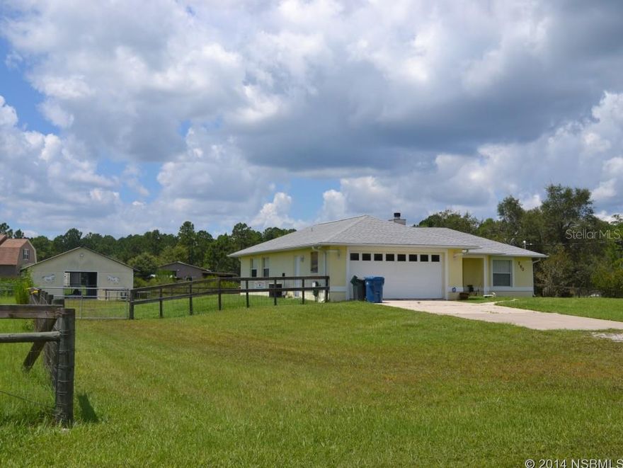 Country Home with four stall horse barn.  Two Pastures, for rotation in grazing. New Roof 2011 wired for generator. Home features cathedral ceilings, French doors from kitchen dining area to screened in porch.   Split bedroom plan.  Oversized 2 car garage.  Easy drive to Deltona, New Smyrna or Port Orange.   Large living room with wood burning fireplace.  Room for pool, RV and boat storage.  Parcel # 8806-01-03-0460 Also included to total 2.5 acres.