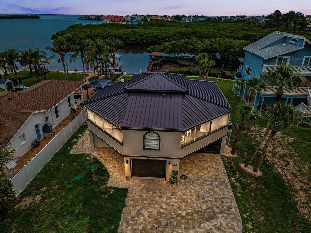 Photo of 1616 Sea Breeze Drive, Tarpon Springs, FL 34689 (MLS # W7873033)