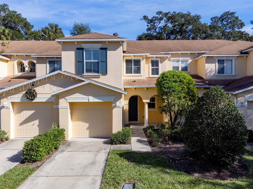 One or more photo(s) has been virtually staged. This upgraded, light and bright townhouse has a large 1,824 living space. Featuring the highly desired great room concept with kitchen, dining, 1/2 bath, and living room all located on the main level. Upon entry your attention will be drawn to the ceramic tile flooring, that perfectly compliments the freshly painted interior that leads into the wood laminate flooring. In the kitchen you will find trendy white cabinets with crown molding, brand new sleek stainless steel appliances, beautiful quartz counter tops, large breakfast bar/island, newly installed tile back splash, single bowl stainless steel sink with pull out faucet and a myriad of cabinets and a large closet pantry. Spacious dining room and handy breakfast bar allows for additional seating and a great space to entertain friends and family. Half bathroom located off the foyer with pedestal sink, nickel faucet, mirror and light. Leading upstairs is wood stair treads. At the top of the stairs you will find the laundry closet (washer and dryer convey) and 3 generously sized bedrooms, 2 full bathrooms. The master bathroom also features glass doors dual quartz vanities with undermount sinks, white cabinets with doors and drawers, tub/shower combo with glass doors, nickel lighting and the master bedroom features a walk in closet. The secondary bathroom has a modern vanity with white cabinets with drawers and nickel hardware, tub/shower combo with glass doors, quartz counter top, undermount sink, nickel lighting.  Brand new laminate flooring in hallway and bedrooms. With no neighbors directly behind you. There is a great patio space out the back sliders which is perfect for grilling out or just relaxing after a long day of work. Stop spending your weekends doing yard work and start having fun in the sun at the community pool. The low maintenance community of St. Charles Place is beautifully landscaped and centrally located near dining, shopping, the crosstown and major highways. Easy commute to downtown Tampa. New AC and Hot Water Heater. No CDD Community.