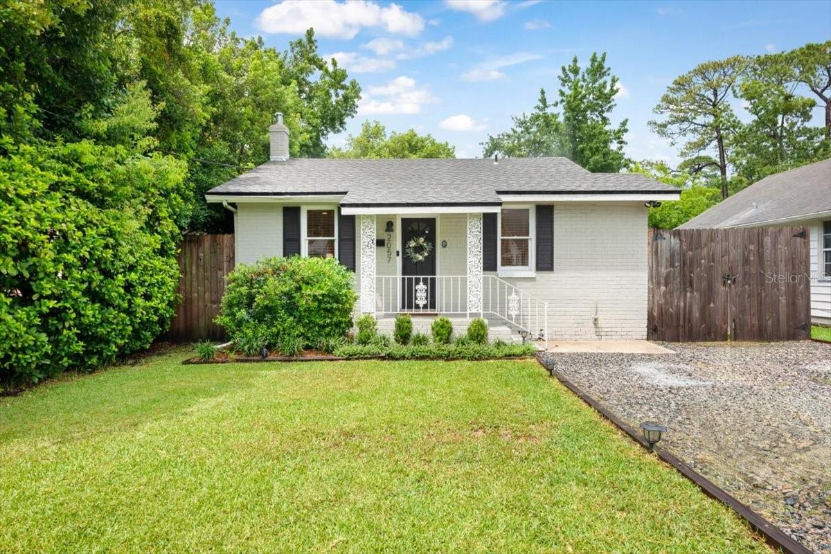 This beautifully renovated and well-maintained 3-bedroom, 2-bath home blends timeless character with thoughtful modern updates. The kitchen features a granite waterfall island, matching granite countertops, and stylish open shelving—offering both function and a fresh, contemporary look. LVP flooring runs throughout the entire home, complementing the bright, open layout.The primary suite includes an updated en-suite bath, and both bathrooms have been tastefully finished with modern touches. Step outside to a spacious backyard with an 8-foot privacy fence, detached 2-car garage, and separate laundry room—ideal for storage.Additional upgrades include a newer roof (2020), newer AC, and updated plumbing and electrical. Located within walking distance to the restaurants and shoppes of San Marco, with easy access to downtown Jacksonville and the Southbank Riverwalk, this move-in ready home offers the perfect blend of classic charm and modern comfort. A must-see!