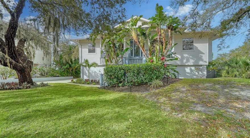 Discover this enchanting Old Florida, very private, waterfront, Sarasota Gated Community. Fishermen’s Bay is located on the mainland and Little Sarasota Bay, directly across from southern Siesta Key and offers direct bay frontage with dramatic sunsets. This elegant, yet casual 3038 square foot home features four bedrooms, three bathrooms, Living and Dining Room great room, plus 1,369 square feet of air conditioned storage on the ground level (basement) and five car-garage with 1,531 square feet of room for extra cars, small boats or a spacious garage workspace. The main level with its modern/contemporary styling is elevated offering water views from three double set of sliders on over a half-plus acre lot. Clean lines with gorgeous real oak wood flooring, crown molding, and both Southern-Style; a front porch (6 x 31) and a rear porch (8 x 23) with a direct Bay view, creating the perfect outdoor oasis for entertaining. The updated dream Kitchen is the heart of this home. There are miles of granite countertops, custom wood cabinetry, newer stainless-steel appliances, and breakfast bar. The Primary Bedroom Suite retreat offers an abundance of windows for breathtaking views, luxurious Primary Bath with spa like tub, and a walk-in shower with dual heads, plus three closets. Enjoy Florida outdoor living as the amenities include a heated pool, spa, outdoor covered grill with granite countertops and a 4 X 19 composite private dock for small boats, with easy access to the inter coastal waterway and close to midnight pass great for kayaking or paddleboarding amongst the mangroves with a community boardwalk and fishing pier.   The standing-seam metal roof was new in 1996. This enclave is for those who appreciate the natural charm of the old Florida lifestyle in a most convenient location close to shopping, dining, beaches, Pine View School, and the other public schools.  

Notable improvements have been: in 2021, Holiday Pools resurfaced the pool, with new tile, and a 45 x 70 Paver Brick and wooden deck surrounding the pool. All in 2020: Alpha Foundation Specialists repaired all settling foundation cracks throughout the structure and the pool area. Absolute Aluminum built a new HVAC platform for all three HVAC new HVAC systems installed by Tri-County Air. Jansen & Sons installed a new spray foam insulation. Detweilers installed two new 175-gallon propane tanks for the Kitchen range and the spa. Jessup's Appliances installed the cooktop, range, dishwasher, microwave, refrigerator, washer and dryer. Advanced Plumbing replumbed the entire home, as a preventive measure because the home is 30 years young. FYI, there have been no leaks. D & D Garage installed three new garage door openers. The 18 x 18 covered summer Kitchen with wooden decking and granite countertops has a new outdoor grill. Suncoast Environmental Group does legal mangrove trimming once a year to maintain the incredible Bay view.

There is a five-car garage with three doors. The two-car stalls are 18 x 20 each, and the one-car stall is 12 x 20. The extended garage to the rear is 12 x 37, for tandem parking or other motorized items, with higher ceilings in the garage and basement area.