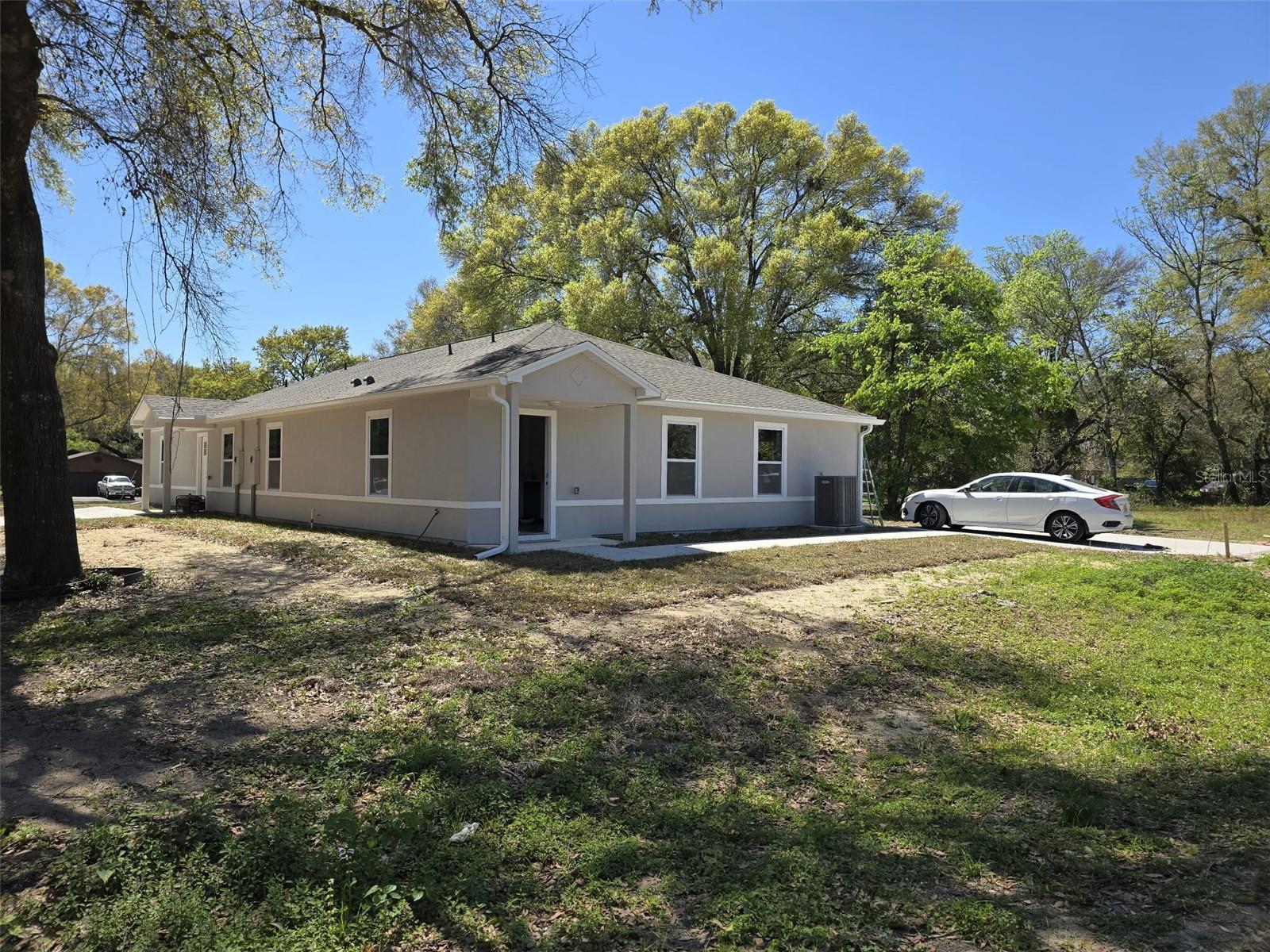 Attention Investors! This newly built duplex in Ocala, FL—completed in 2025—offers an exceptional opportunity to own a high-demand, low-maintenance income property. Each unit features 3 spacious bedrooms and 2 bathrooms, open-concept living areas, quartz countertops in kitchen and bathrooms, stainless steel appliances -Refrigerator, range, microwave dishwasher, disposal, in-unit laundry. DOUBLE vanities with QUARTZ counter tops, and WALK-IN SHOWER in the MASTER suites. Efficient HVAC systems and heat pumps for EACH UNIT. A rare find, it’s CONNECTED to PUBLIC SEWER AND WATER, and each unit has INDEPENDENT electric and water METER, maximizing utility efficiency and tenant independence. ADDITIONAL perks include PRIVATE rear patios, PARKING for two vehicles driveways, NO HOA, and a solid rental income. Located in a growing area with strong rental demand, LESS than 3 miles from hospital, shopping plaza, Ocala's historic Downtown, supermarket; 8 MILES to the great WORLD EQUESTRIAN CENTER...5 minutes to the airport and MUCH MORE!! This is the perfect turnkey investment—schedule your private tour today before it's gone! THE INFORMATION PROVIDED HEREIN IS FOR INFORMATIONAL PURPOSES ONLY AND IS NOT GUARANTEED TO BE ACCURATE OR COMPLETE. IT IS THE RESPONSIBILITY OF THE BUYER, AND/OR THEIR RESPECTIVE AGENTS TO VERIFY ALL FACTS AND PERFORM THEIR OWN DUE DILIGENCE REGARDING ANY PROPERTY, PRICING, OR MARKET DATA REFERENCED.