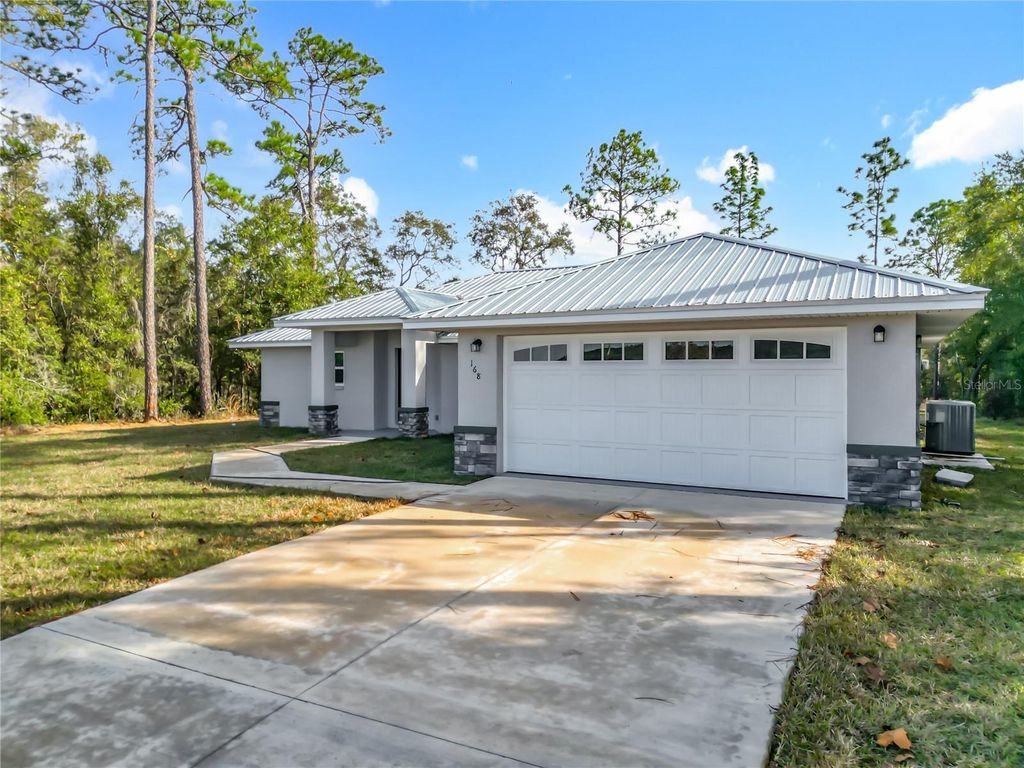 Photo of 168 W Citrus Springs Boulevard, Citrus Springs, FL 34434 (MLS # O6366422)