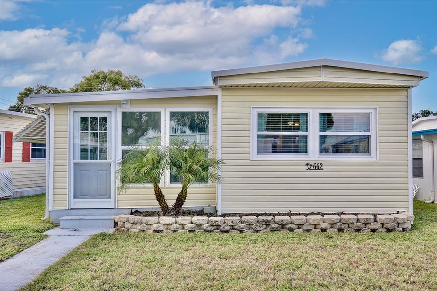 Welcome home! Situated right next to downtown Tavares on Lake Dora, this community sits at the mouth of the Dora Canal and offers many water amenities. This charming two bedroom home was completely renovated in 2022 and is being sold furnished. New siding, windows, metal roof was coated, new AC, flooring, kitchen, new appliances and bathroom. The cheery exterior brings you into the sunny Florida room with wall to wall windows and tile floors. Stepping inside the living room filled with natural light you’ll find neutral colors and wood style floors. The kitchen offers shaker cabinets, stainless steel appliances, beautiful backsplash with dining area. The primary bedroom features built in storage drawers, crown molding, and a half bath through a plantation shutter style door. The luxurious main bathroom showcases ample counter and cabinet space and a gorgeous shower with floor to ceiling tile. In the hallway you’ll find a spacious storage closet and a laundry nook with washer. The covered carport provides access to another storage room which could be utilized as a workshop with dryer. Walking distance to the community center, spend the weekends fishing out on the lake or play a game of shuffleboard with your friendly neighbors. Take a bike or golf cart ride to the downtown area and watch the planes take off from the seaport, have a drink with live music at one of the many downtown restaurants, visit community events and take a walk around Wooton Park. You also have quick access to shopping, medical facilities and major attractions, parks and airport. Come experience Florida living the way it was meant to be! Call today to schedule a showing to see this beautifully renovated two bedroom home in downtown Tavares.