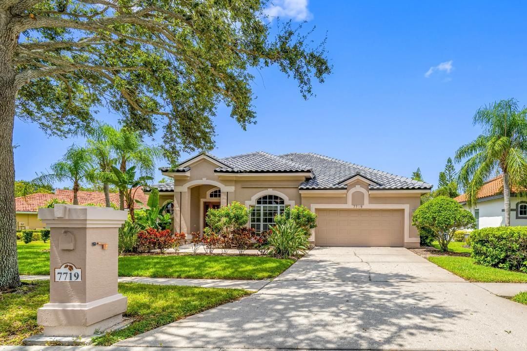This is a rare opportunity to own this beautiful one-floor, three-bedroom, 2.5 bath home with a private office and playroom in the exclusive Copperleaf section of the Bayou Club. The Bayou Club is a premier family-friendly 24-hour gated country-club community with the award-winning Tom Fazio Signature Golf course and the Bardmoor tennis/pickleball facility next-door. The floor plan is stylishly designed with an open living room and dining room in the front of the home, a large grand family room and kitchen in the back and a playroom between bedrooms 2 and 3. The large, paved deck within a high screen enclosure has a pool/spa, a covered lanai and an outdoor hot/cold shower. The deck has access via three sliding glass doors from the family room, living room and primary bedroom. There are 10-foot high ceilings throughout the home which accent its comfortable feel with an open kitchen design which has new appliances including the refrigerator/freezer, double oven, gas stovetop and microwave. This home is lovingly maintained, move-in ready and made for memories with a new tile roof (April 2025), a new air conditioning system with whole-house air-filtration (June 2025), a new water heater (January 2025), a whole-house water softener and a kitchen reverse-osmosis system. All carpeting in the three bedrooms and playroom is new (July 2025) and there is an EV/hybrid NEMA 14-50 level 2 charging outlet in the spacious two-car garage. There is plenty of storage and a large walk-in closet in the primary bedroom. An added unique feature is that the back of the home faces a large community-owned oval, tree-lined grassy area, ideal for children to play. The property is safely in an X flood zone, unaffected by the 2024 storms. This home is priced to make your dreams come true, within minutes to the beaches, downtown St Petersburg and Tampa. Your happy place is waiting with quiet oak-lined streets and friendly neighbors.