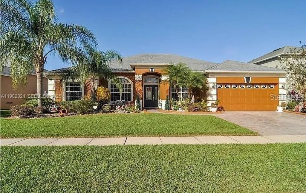 Photo of 18081 Thornhill Grand Circle, Orlando, FL 32820 (MLS # O6404146)