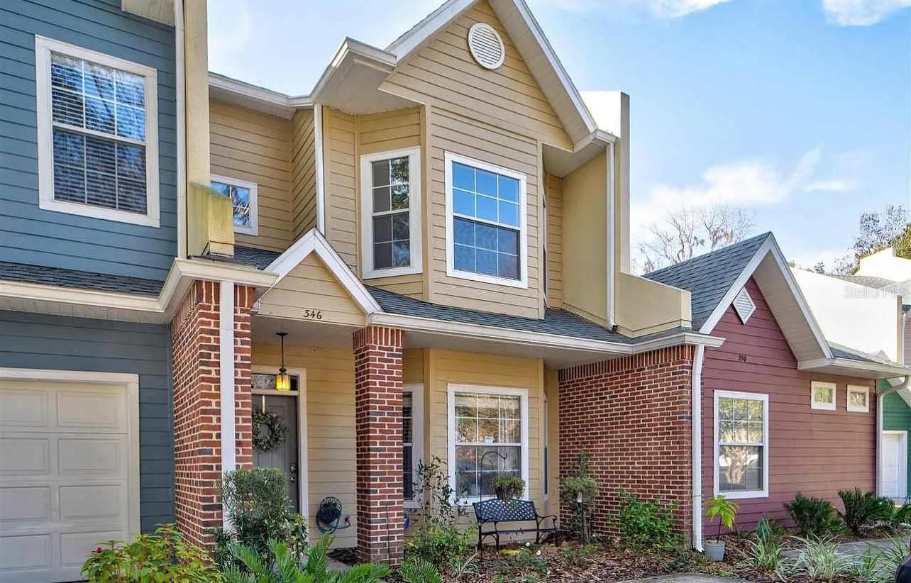 Welcome to a beautifully maintained 2-bedroom, 2-bathroom townhome with a spacious loft, perfectly located just minutes from the University of Florida, UF Health/Shands, and Butler Plaza. Step inside to find a bright, open floor plan with vaulted ceilings and natural light. The living and dining areas flow seamlessly, creating an inviting space for both relaxing and entertaining. The updated kitchen features ample cabinet space and a breakfast bar overlooking the main living area. The primary suite is conveniently located on the first floor with a fully renovated bath and generous closet space. Upstairs, you’ll find a second bedroom, a full bathroom, and a versatile loft that can serve as an office, guest room, or play area. Enjoy your morning coffee in the wooded backyard with a beautiful, lush greenery view. This quiet community offers a pool, tennis court, and well-maintained landscaping, providing a low-maintenance lifestyle with great amenities. Washer & dryer included. Easy access to I-75, UF campus, Santa Fe College, and Gainesville’s best dining, shopping, and parks. GFH is just across the street from this neighborhood.