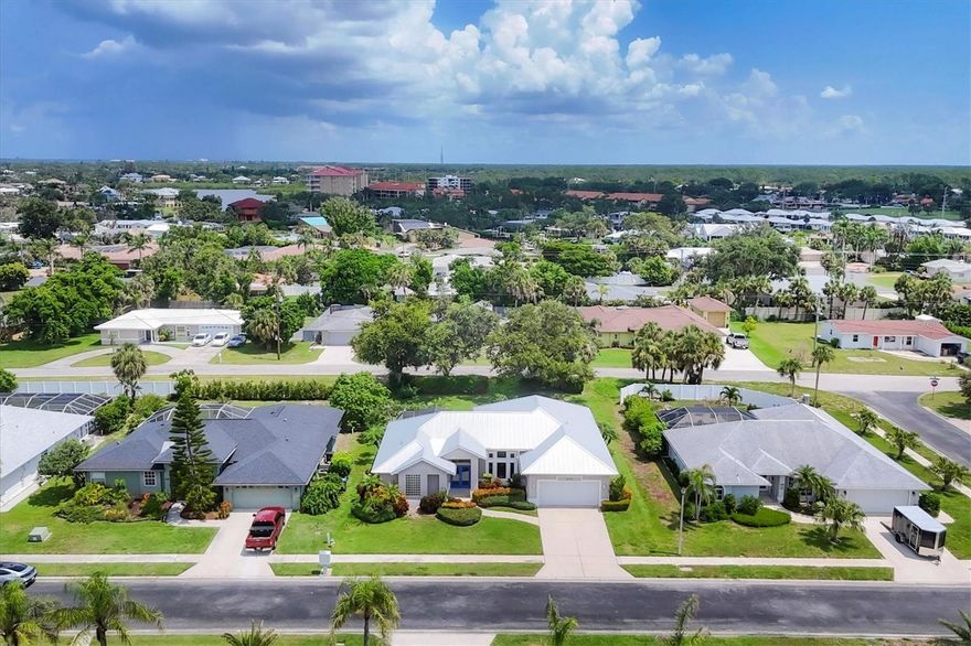 This is the one you’ve been waiting for! An incredible opportunity to own a stunning, contemporary ranch home with coastal accents in the desirable Sorrento Bayside community just minutes from white sandy beaches and blue gulf waters. Bursting with natural light and charm, this beautifully updated home features soaring vaulted ceilings, an open concept layout, and a split bedroom floor plan that offers a blend of space, style and privacy. The kitchen is a showstopper with a large center island ideal for everything from quick breakfasts to hosting friends and family. Recent upgrades include a sleek standing seam metal roof (2020), and HVAC system (2022), newer washer and dryer, fresh interior paint, and modern tile flooring throughout. French doors and expansive windows flood the space with sunshine, giving the home a bright, breezy feel. Go outside to your private backyard oasis featuring a huge, screened lanai, built-in hot tub, and a fully equipped outdoor kitchen ideal for entertaining or simply unwinding under the stars. Just a short distance away, you’ll find Nokomis Beach and Casey Key, along with a variety of waterfront restaurants and local favorites. Whether you’re seeking a year-round residence or a seasonal escape, this home delivers unparalleled access to the best of Florida’s Gulf Coast lifestyle. Make this your next adventure.