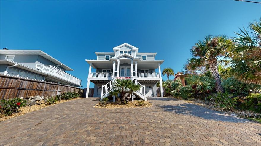Mornings first glimpse of sunrise from your ocean front balcony promises for another day in paradise. A cup of coffee and making plans for the first day of the rest of your life knowing your dream home belongs to you. This can be you and yours available in a luxury home located directly on the Atlantic Ocean. Positioned on an elevated lot giving spectacular views of mother nature's bounty.
This luxury property is a must see, you will immediately fall in love. On those nippy fall and winter mornings warm up next to your gas fireplace. As the day warms head out to the beach for a jog or walk or even better a bike ride.  Perfect days await you!  Additional features include a 932 sf. finished garage with epoxy coated floor, as well as a complete workshop and mudroom for rainy days and muddy dogs. After a long day at the beach take your private elevator to the living quarters. Kitchen features top brand appliances under counter wine cooler, granite counter tops and special under sink water heater for dishwasher. Home also features a 20kw generator which activates as a result of loss of power. More luxury features are solar shades; new outdoor compressors with an additional protective coating to protect from the elements. As a final touch, the home is constructed twenty three feet above sea level. Reference Documents for survey. ;Water: City