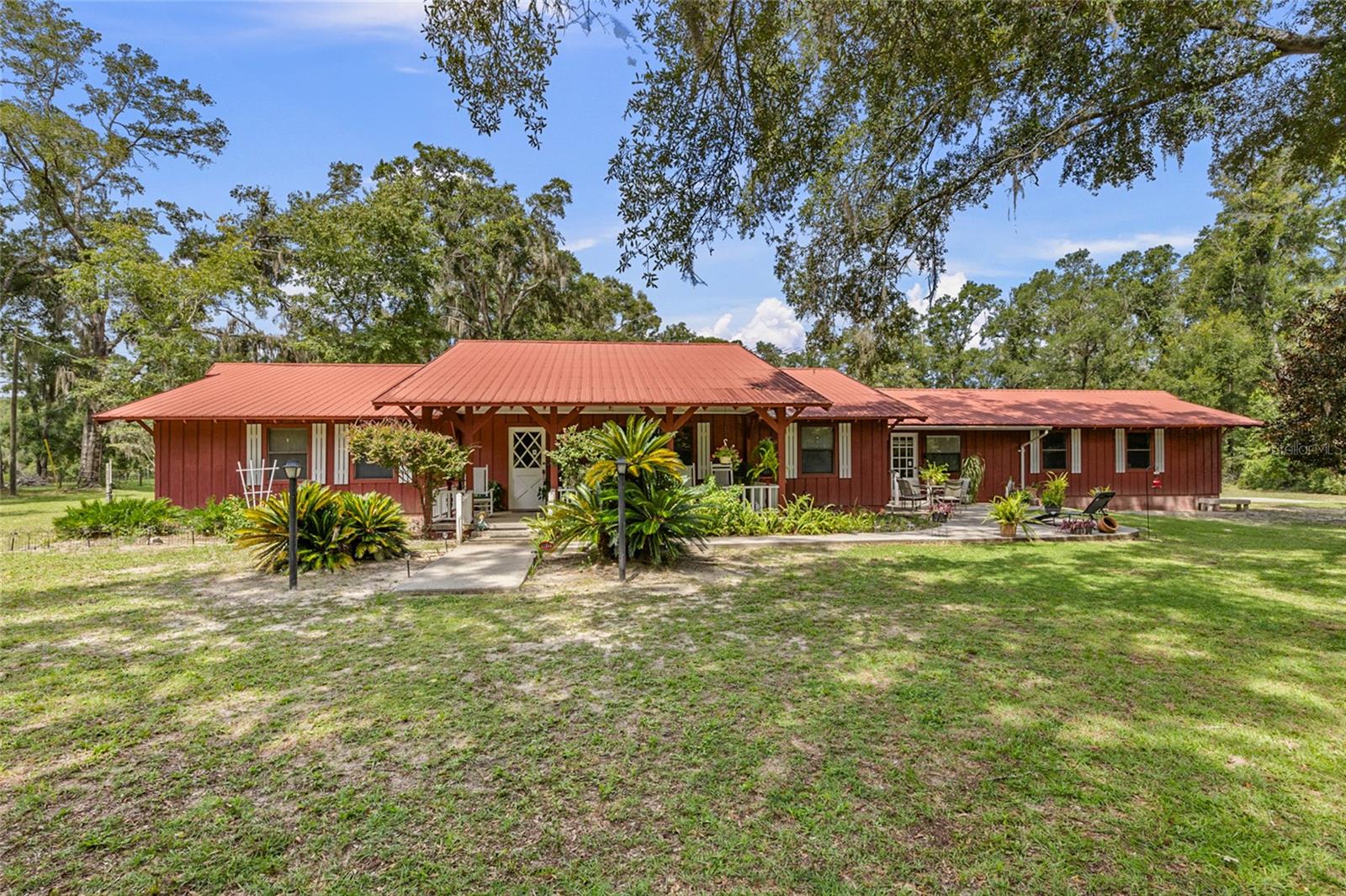 Located on 2.62 private acres on a paved road with no HOA or deed restrictions this charming 3BR/2BA home offers over 2,300 sq. ft. of living space, designed for both comfort and functionality. From the moment you enter, you’ll appreciate the spacious layout featuring a formal living room, formal dining room, a cozy family room, and a versatile bonus room conveniently located off the kitchen. The oversized bathrooms are a rare find, and every room of the home reflects the care and attention it has received from its single, original owner. With a sturdy metal roof and a spotless interior, this property is move-in ready. The oversized garage is more than just parking—it provides an expansive workshop space perfect for storage, projects, or hobbies. Outside, the home is nestled on 2.62 private acres, giving you plenty of room for gardening, livestock, or simply enjoying the peace of country living. Surrounded by natural beauty yet just minutes from town, this property is a rare blend of privacy, practicality, and pride of ownership.