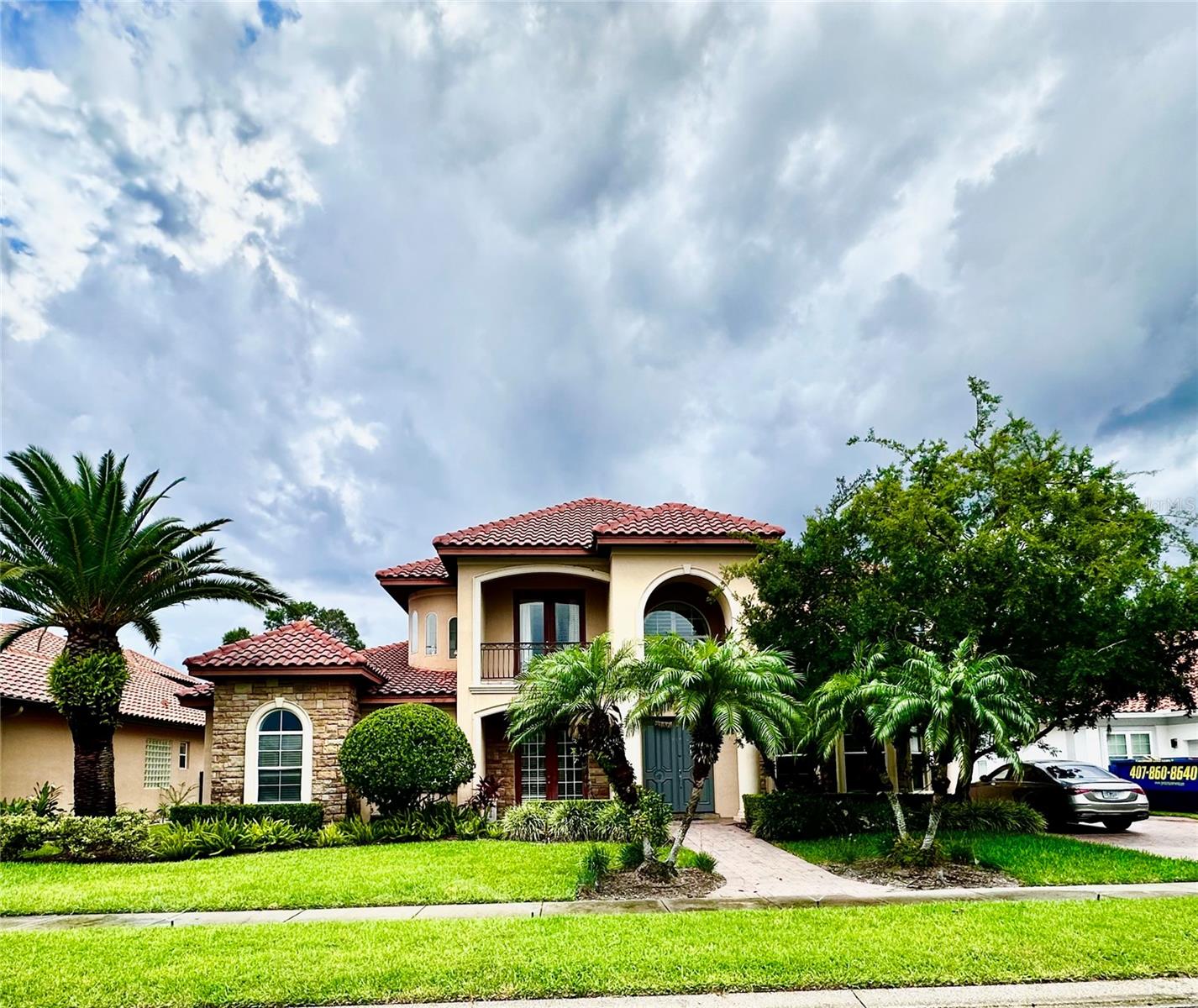 This masterfully crafted Reiche and Silliman pool home offers 5 spacious bedrooms, 4.5 bathrooms, over 4,500 square feet of living space, a 3-car garage, and an exceptional outdoor entertainment area. As you approach, you're greeted by lush landscaping, an expansive driveway, with portico, setting the tone for this exquisite residence. Step inside to a breathtaking interior filled with natural light from oversized windows, cathedral ceilings, and a modern open-concept design. The home has been freshly painted and has a seamless flow throughout the living areas. The open floor plan includes a huge great room with crystal chandelier, a kitchen with large bar area for additional seating along with seating area adjacent to the kitchen for morning coffee or breakfast. As you exit the kitchen on the left, you will find a beautiful grand dining room, and cozy, private seating. Next to the front door you will find a den, home office or additional bedroom with walk in closet and doors to the outside. At the heart of this home is the kitchen, designed for culinary excellence with an expansive island, premium appliances, a gas cooktop, granite countertops, and upgraded cabinetry. Whether you're entertaining or preparing gourmet meals, this space truly delivers. The FIRST FLOOR, huge, owner's suite offers complete privacy in a true split floor plan. The suite features a custom walk-in closet, an expansive bedroom, and a spa-like ensuite bathroom with dual vanities, a walk-in shower, and a soaking tub. Upstairs, the versatile loft area provides endless possibilities plus a huge movie theater with projector, bar and billiards table. The outdoor space is an entertainer's paradise. The 10-foot pocket sliding glass doors overlook the stunning pool views from every angle and blend indoor and outdoor living seamlessly. The covered lanai creates an inviting space to relax. Whether cooling off in the pool or enjoying the covered space it is designed for ultimate leisure. This one-of-a-kind home combines luxury, comfort, and privacy, making it an entertainer's dream. Nestled within a well-established gated community, this property enjoys an enviable location close to major highways, ensuring convenient access to all amenities. Just minutes away, residents can indulge in excellent shopping opportunities, dine at a variety of luxury and casual eateries, and explore nearby theme parks for entertainment. The neighborhood benefits from proximity to brand-new, state-of-the-art hospitals and a top-notch school system, providing peace of mind for residents seeking quality healthcare services and high-end education. Whether it's shopping, dining, entertainment, education, or healthcare, this vibrant community offers an abundance of options to suit every lifestyle need and preference. Call today to schedule a tour.