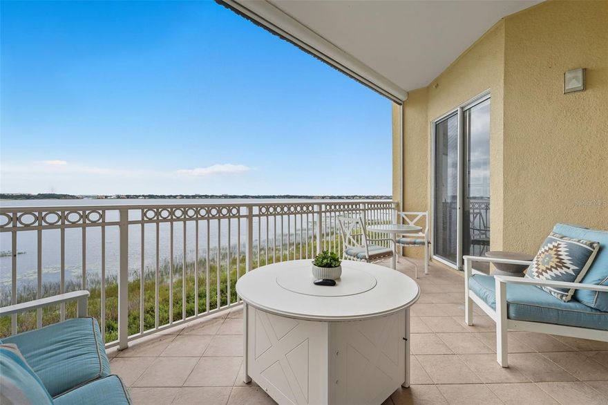 Beautifully remodeled with breathtaking views of Big Sand Lake! Located in the heart of Dr. Phillips, this stunning 2-bedroom, 2-bath residence in the guard-gated community of Vizcaya offers luxury living at its finest. Situated in an elevator building, this move-in-ready unit features a modern, open floor plan with high-end finishes throughout, including updated flooring, lighting, quartz countertops, door hardware, paint, tile, custom drapes, and so much more!

Enjoy unobstructed views of Big Sand Lake from your private balcony, living room, and primary suite of this South facing unit. The spacious kitchen opens to the dining and living areas, perfect for entertaining. The spa-like primary suite bathroom includes dual sinks, a large walk-in shower, and two walk-in closets for plenty of storage.

Additional features include assigned garage parking, a storage unit, and a 24-hour manned gate. Community amenities include 2 resort-style pools, a clubhouse, fitness center, and 2 tennis courts.

Just minutes to Restaurant Row, major highways, theme parks, and all that vibrant Dr. Phillips has to offer. A rare opportunity to own a beautifully updated lakefront condo in one of Orlando’s most desirable neighborhoods! Perfect for anyone looking for the lock and leave or maintenance-free lifestyle!
