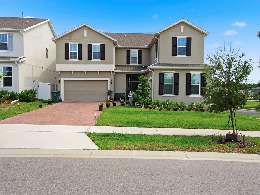 Located in desirable West DeLand, this stunning 2024-built multigenerational home offers the perfect blend of modern design, space, and functionality. Featuring 5 bedrooms, 3.5 bathrooms, and an impressive layout designed for both everyday living and entertaining, this home stands out with thoughtful upgrades throughout. The first floor showcases a spacious living area, formal dining space, flex room, mudroom, and a beautifully designed kitchen complete with a massive island, upgraded appliances, wall oven, stylish countertops, and a breakfast nook. A craft room or optional additional bedroom adds even more versatility.

One of the home’s most unique features is its dual staircase design, creating seamless flow between living spaces. Upstairs, you’ll find an expansive family and playroom area along with a luxurious primary suite featuring a private sitting room, spa-inspired bath, and dual walk-in closets. Additional bedrooms, bathrooms, and a conveniently located laundry room provide ample space for a large household or guests.

Situated on a private corner lot with a privacy wall, this home also features a 3-car garage plus extended driveway parking for up to five additional vehicles. Designed with comfort, entertaining, and multigenerational living in mind, this exceptional property offers the feel of brand-new construction without the wait.