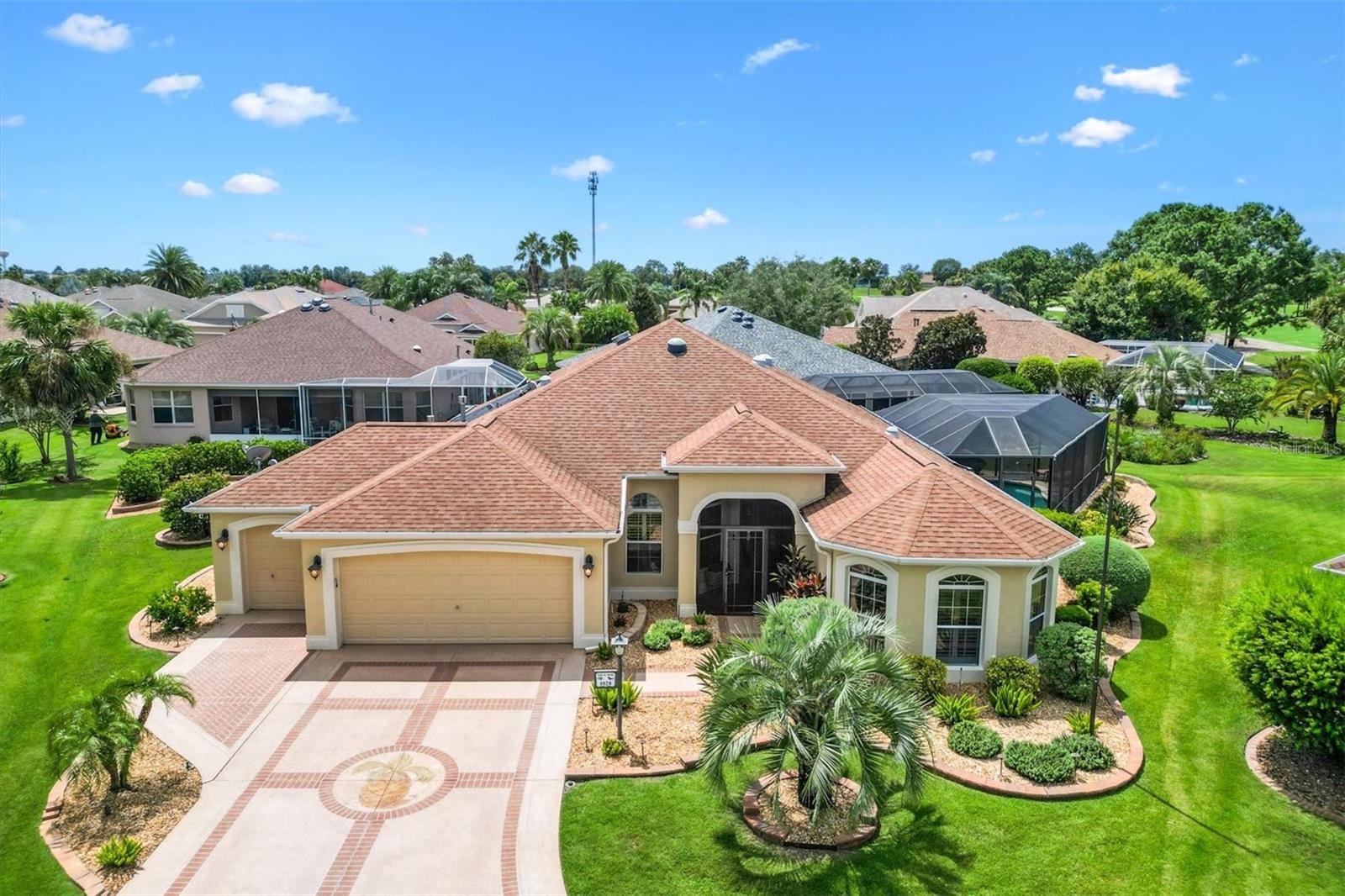 Stunning 3/2 Expanded Gardenia Pool home with Golf course View. Situated in an oversized cul-de-sac lot in the Village of Largo. NO BOND! Roof and HVAC Replaced 2015. Exterior Painted 2019. 2 1/2 miles to Lake Sumter Landing.
This beautifully appointed home welcomes you with a screened front porch and a charming stained-glass door with side panel and transom windows. Step inside to discover tiled flooring laid on the diagonal with 2 decorative inlaid medallions (entry and kitchen), complemented by five solar tubes that fill the home with natural light. Wood-look laminate flooring adds warmth to the bedrooms.
The eat-in kitchen features stainless steel appliances, a 5-burner gas stove, QUARTZITE counters, oak cabinets with glass fronts, pull-out shelves, a breakfast bar with pendant lighting, and a pantry closet in the adjacent laundry room. Crown molding and plantation shutters run throughout the home, enhancing its elegance.
The split plan layout offers a master bedroom with lanai access, two customized walk-in closets, and an ensuite bath with split vanities, a shower with built-in bench, and a linen closet. Two guest bedrooms also feature custom closets, with a guest bath offering a shower (no tub) and a pocket door for added privacy. The Back bedroom boasts a tray ceiling with double-crown molding and the front bedroom has 3 large bay windows, and a Queen Murphy Bed with sliding Shelves that open in the middle...a great use of space!
Relax or entertain year-round in the enclosed lanai with a mini-split system, privacy shades, and French doors leading to the screened saltwater pool, complete with solar and gas heating and two remote-controlled awnings for shade.
Additional features include: 2 car plus golf cart Garage with electronic screen door, insulated door & epoxy-coated floor, Whole-house water system with filtration, softener & charcoal, MAGIC STAIR KIT for easy access to attic storage, a Built-in safe, Vivant security system, ring door bell, exterior awnings, and painted paver driveway.
View of #1 tee of Bacall and #1 tee of Bogart Golf courses. Located just minutes from Bacall Recreation Center and Largo Pool, and between Lake Sumter Landing and Brownwood Town Center, this is the perfect place to call home! Don’t miss the opportunity to make this beautiful designer home yours and start living the Villages dream.