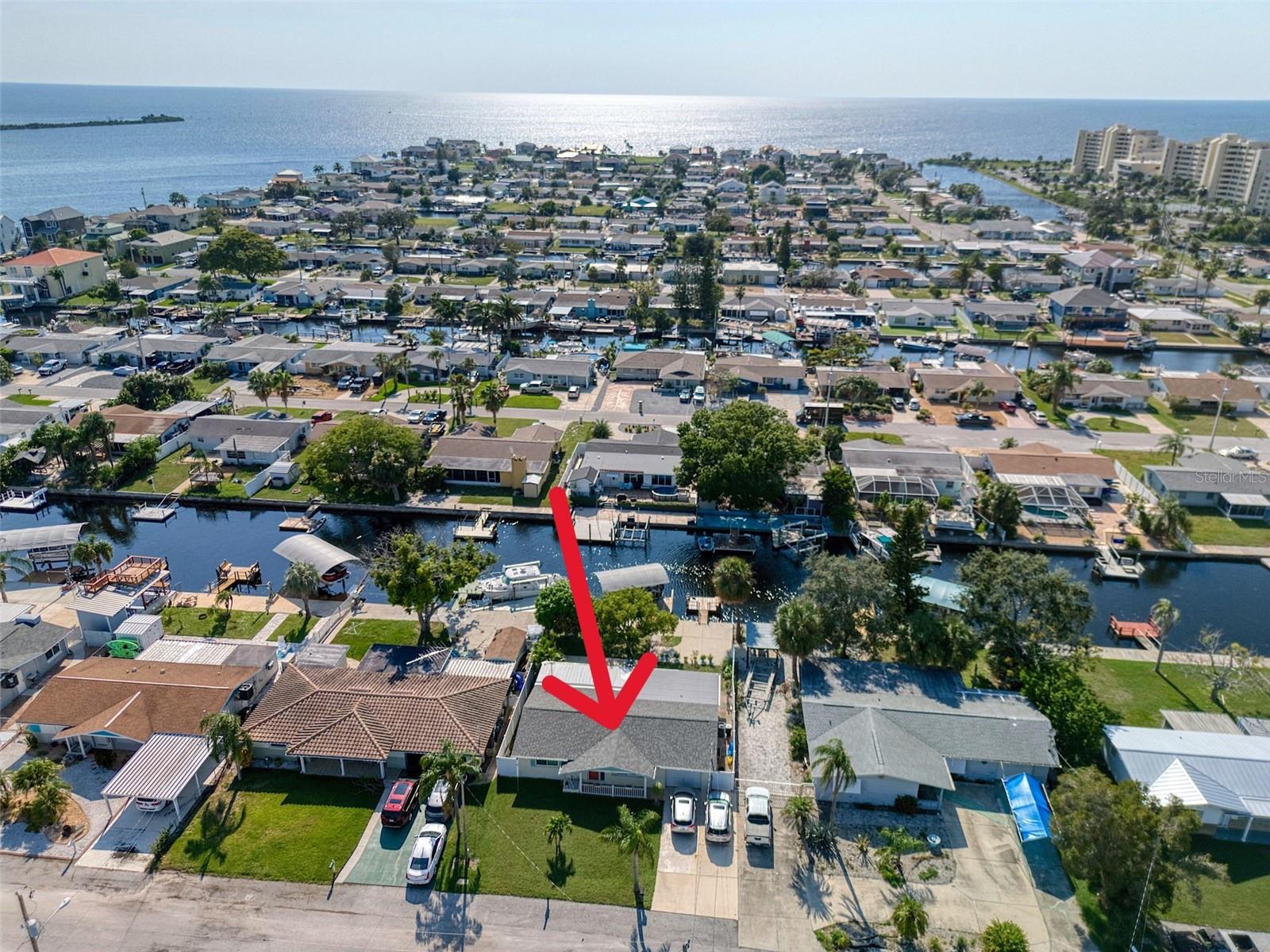 DIRECT GULF ACCESS with NO HOA! And bonus with a BOAT LIFT ALREADY DONE AND COVERED! This 2 bedroom 2 bathroom home has been completely remodeled from top to bottom and is MOVE IN READY! NEW AC and all NEW duct work too! All the cast iron pipes have been replaced as well as the copper lines! NEW kitchen with gorgeous GRANITE countertops and NEW STAINLESS STEEL APPLIANCES! NEW tile floors throughout! NEW front door, lanai door and garage door! NEW impact windows in 2023! NEW exterior paint in 2023! NEW roof in 2022! This home is an open concept and comes with a large screened in back patio with 4 season windows for entertaining your friends and family year-round. Step outside to your fenced in back yard so your fur babies can roam while you sit and relax under the beautiful trees and enjoy the cool sea breeze. There is also a mango and lemon tree. The boatlift is covered for extra protection and has a water supply for easy cleaning. Drop a fishing pole in off the floating dock or hop on your kayaks for a short ride to the open Gulf waters. Hudson Beach is a coastal town located north of Clearwater that is golf cart friendly with waterfront restaurants, tiki bars, a public boat ramp and the beach are just a short ride away. Conveniently located off Hwy 19 for shopping and hospitals nearby and just 15 minutes to the Suncoast Expressway for easy access to downtown Tampa and all major airports. Call me today to schedule your private showing!