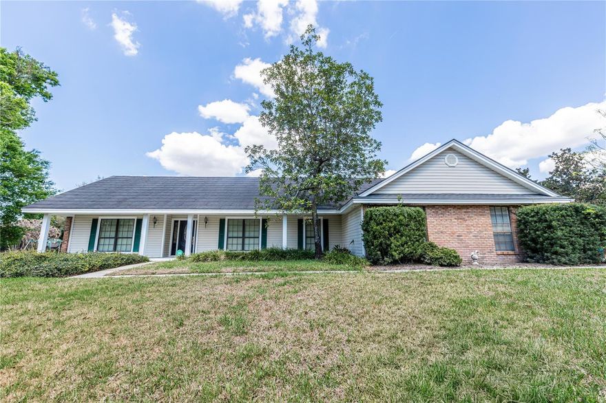 Welcome to this beautifully maintained custom 4-bedroom, 2-bath pool home set on a full 1-acre lot in a quiet, established neighborhood. Built and lovingly cared for by the original owner, this home offers a bright, airy interior with timeless wood trim details that add warmth and character throughout. The spacious family room features a wood-burning fireplace, creating a comfortable gathering space for everyday living and entertaining. Designed for enjoying Florida living, the home includes a large enclosed Florida Room with views of the pool and expansive backyard. Step outside to the extra-large pool deck—perfect for relaxing, hosting friends, or enjoying sunny afternoons. The pool area is fully fenced for added safety. Car enthusiasts, hobbyists, or those needing extra storage will appreciate the oversized side-facing 3-car garage, complete with a dedicated workshop area. The generous one-acre property provides space to spread out, garden, or simply enjoy the peaceful surroundings. Conveniently located near shopping, the local library, and medical facilities, and zoned for highly regarded schools, this home offers both privacy and everyday convenience. With well and septic already in place, you’ll also enjoy the benefit of no water or sewer bills. A wonderful opportunity to own a meticulously cared-for home with space, character, and room to enjoy the Florida lifestyle.